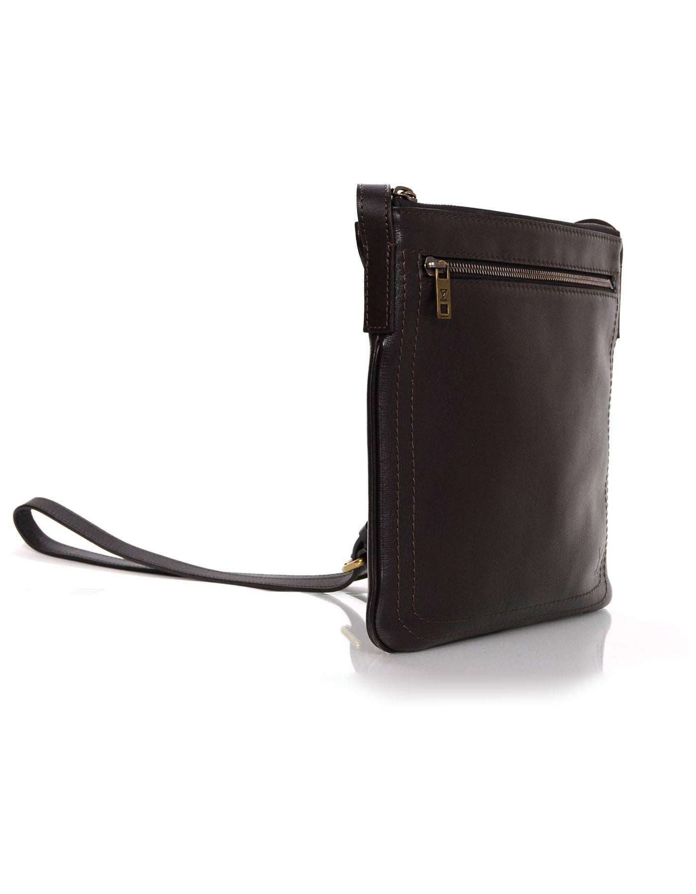 Louis Vuitton Brown Leather Cuir Liege Crossbody Bag 
Features adjustable crossbody strap

Made In: France
Year of Production: 2011
Color: Brown
Hardware: Brass
Materials: Leather
Lining: Brown canvas
Closure/Opening: Zip across top
Exterior