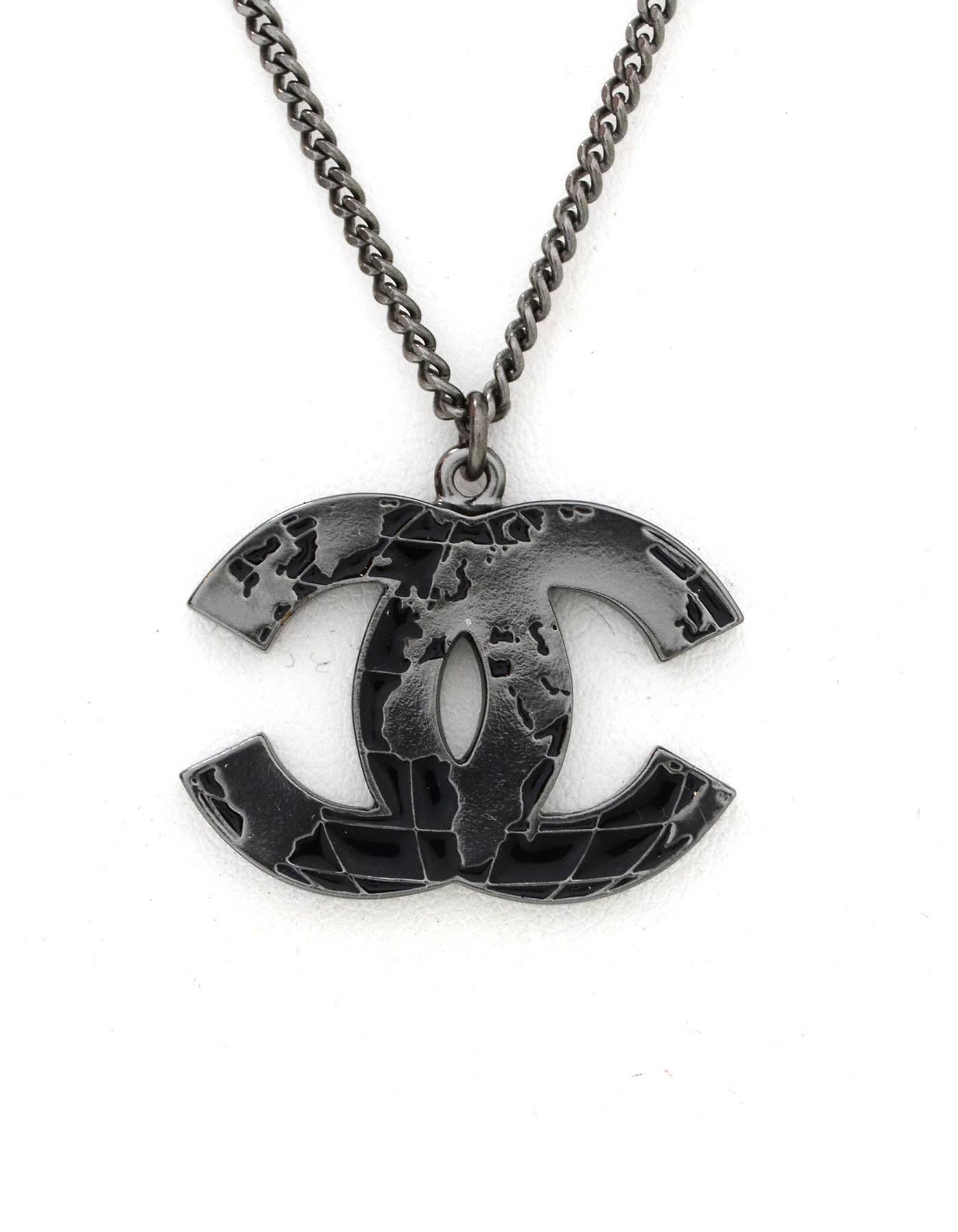 100% Authentic Chanel Gunmetal Globe CC Necklace. Features CC logo with a weathered black diamond-quilt pattern. Excellent pre-owned condition. Two jump rings allow necklace Can be worn short or long.

Made In: France
Year of Production: 2013
Color: