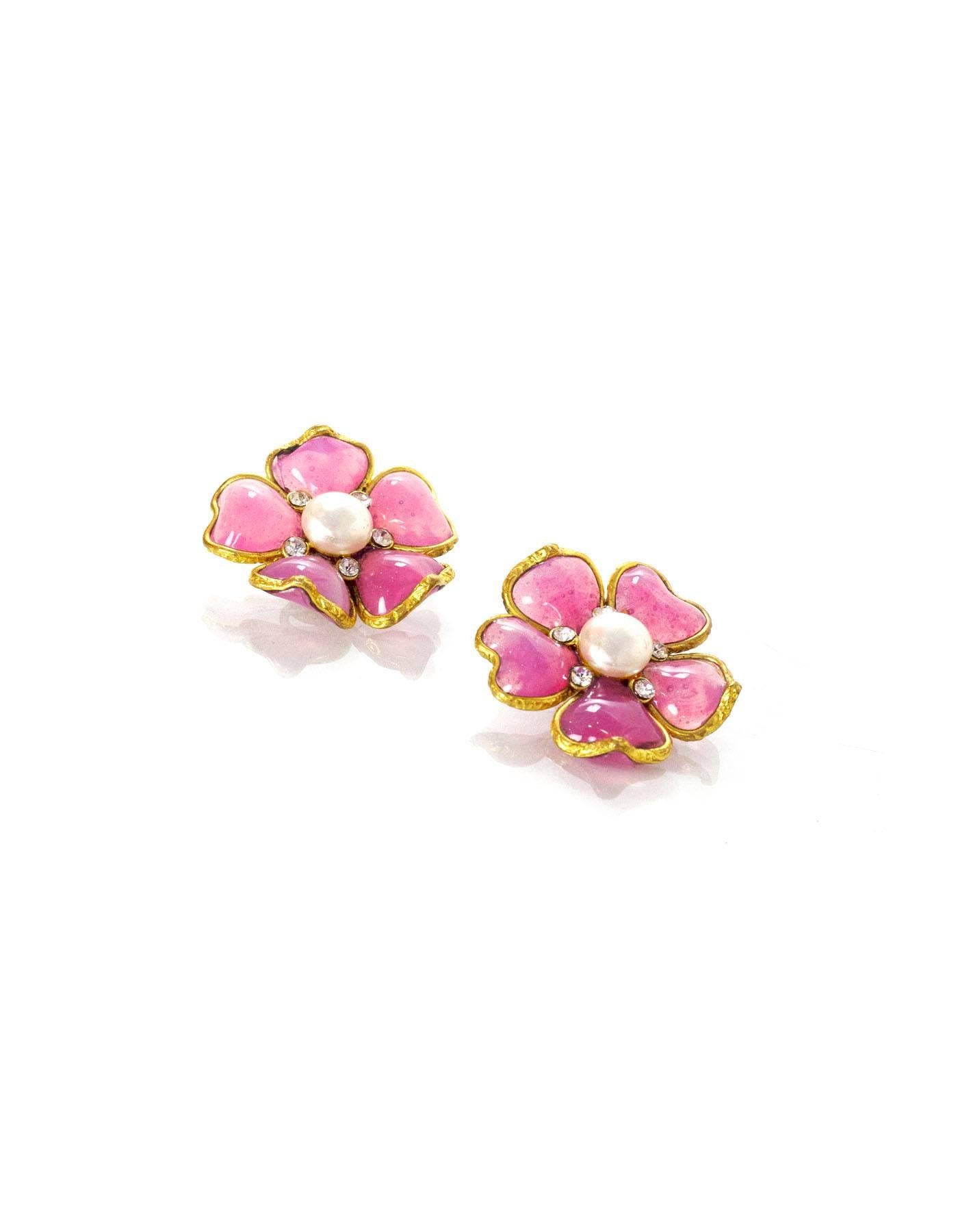 100% Authentic Chanel Pink Gripoix Flower Clip On Earrings. Features pink Gripoix petals with faux pearl center. Gold and crystal detail. Excellent pre-owned condition with the exception of scuffs on the center pearl.

Made In: France
Year of