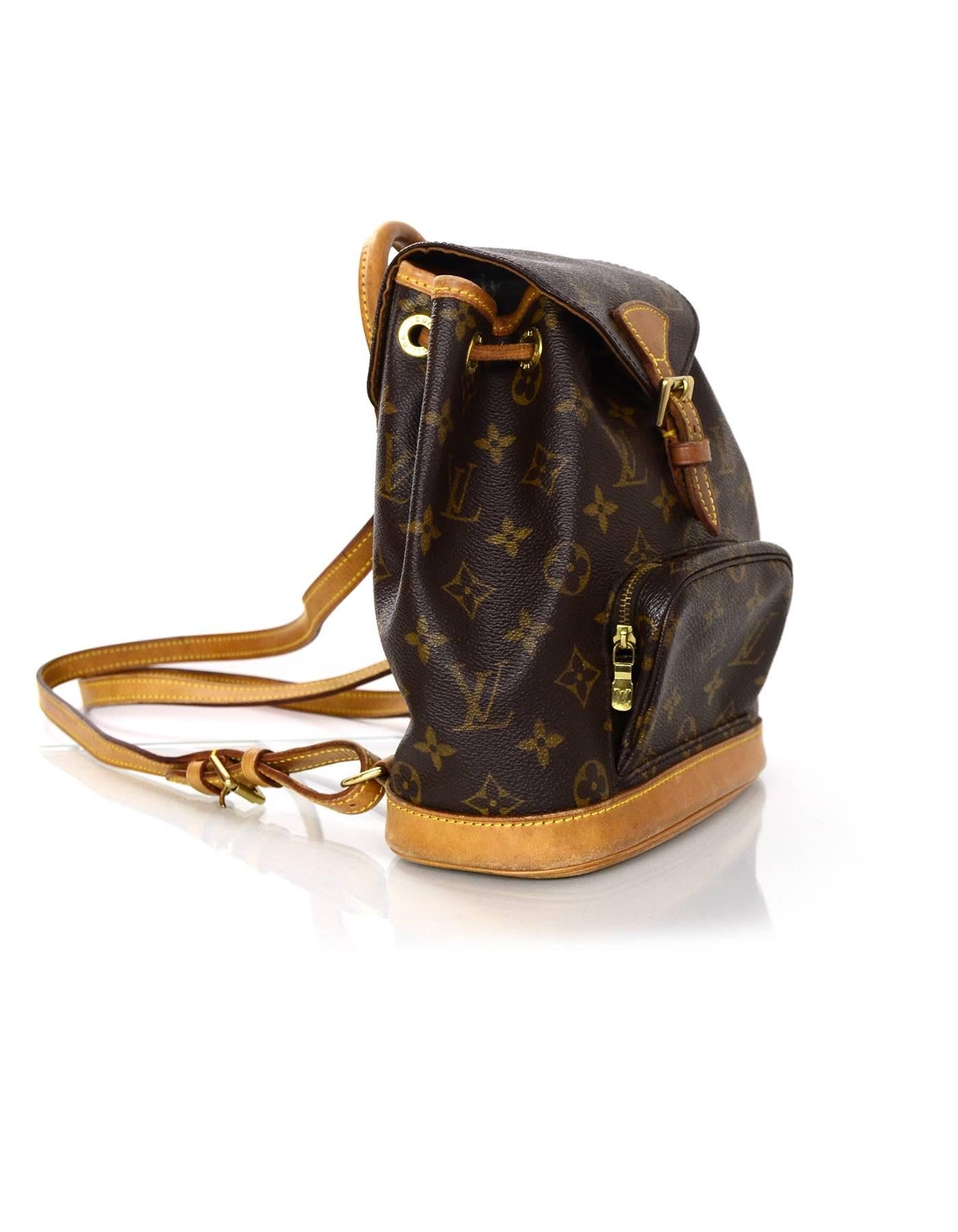 Louis Vuitton Monogram Mini Montsouris Backpack
Features leather trim throughout and adjustable shoulder straps

Made In: France
Year of Production: 1997
Color: Brown
Hardware: Goldtone
Materials: Leather and coated canvas
Lining: Brown