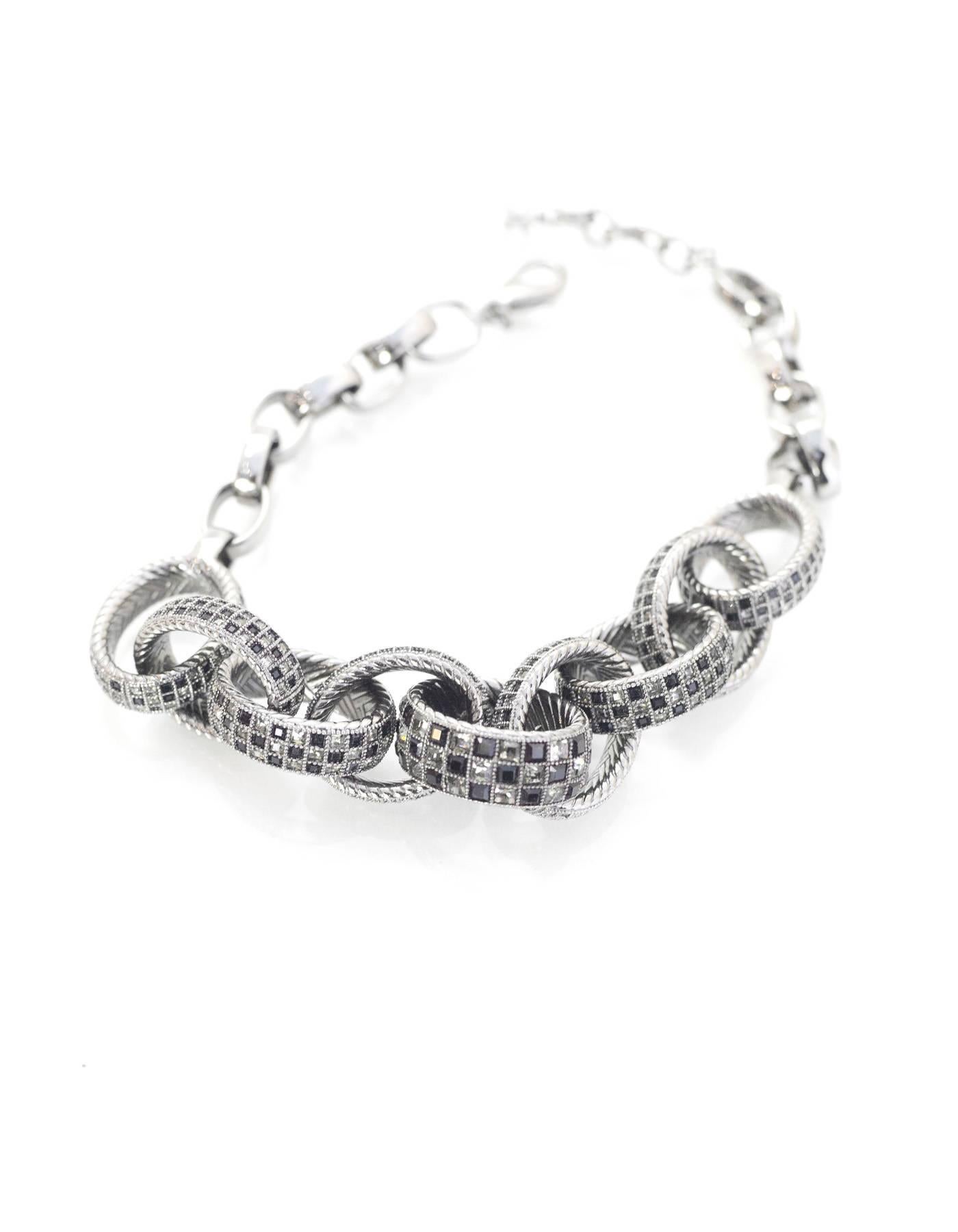 Chanel Black & Grey Crystal Chain Link Choker Necklace

Made In: France
Year of Production: 2016
Color: Ruthenium black and grey
Materials: Metal and crystal
Closure: Lobster claw clasp
Stamp: A16 CC S
Overall Condition: Excellent pre-owned