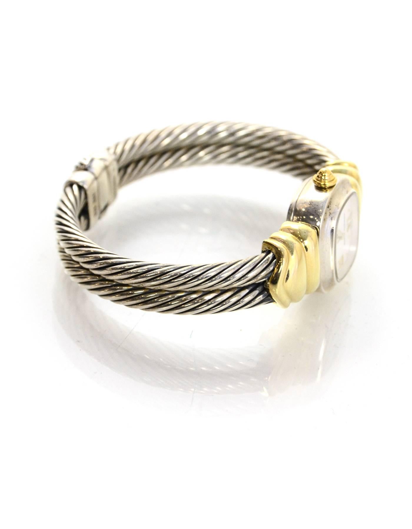 David Yurman Sterling & 14k Double Cable Watch

Made In: Switzerland
Color: Silver and gold
Materials: Sterling silver and 14k gold
Closure: Lift lever
Stamp: Band- 925 585 Face- Swiss Made 925 David Yurman T-51720 Q
Movement: Quartz