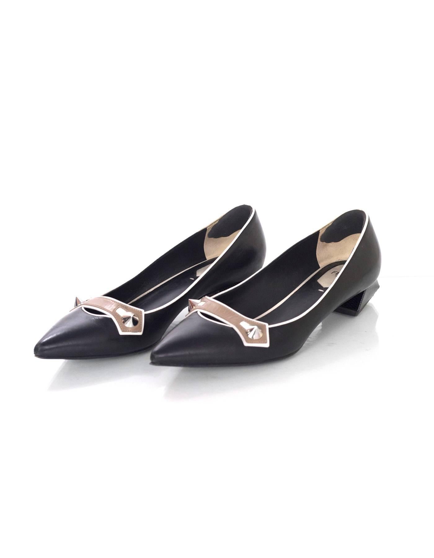 Fendi Black Leather Studded Flats 
Features python wrapped block heel

Made In: Italy
Color: Black and taupe
Materials: Leather and python
Closure/Opening: Slide on
Sole Stamp: Fendi Roma Made in Italy Vero Cuoio 39
Overall Condition: Excellent