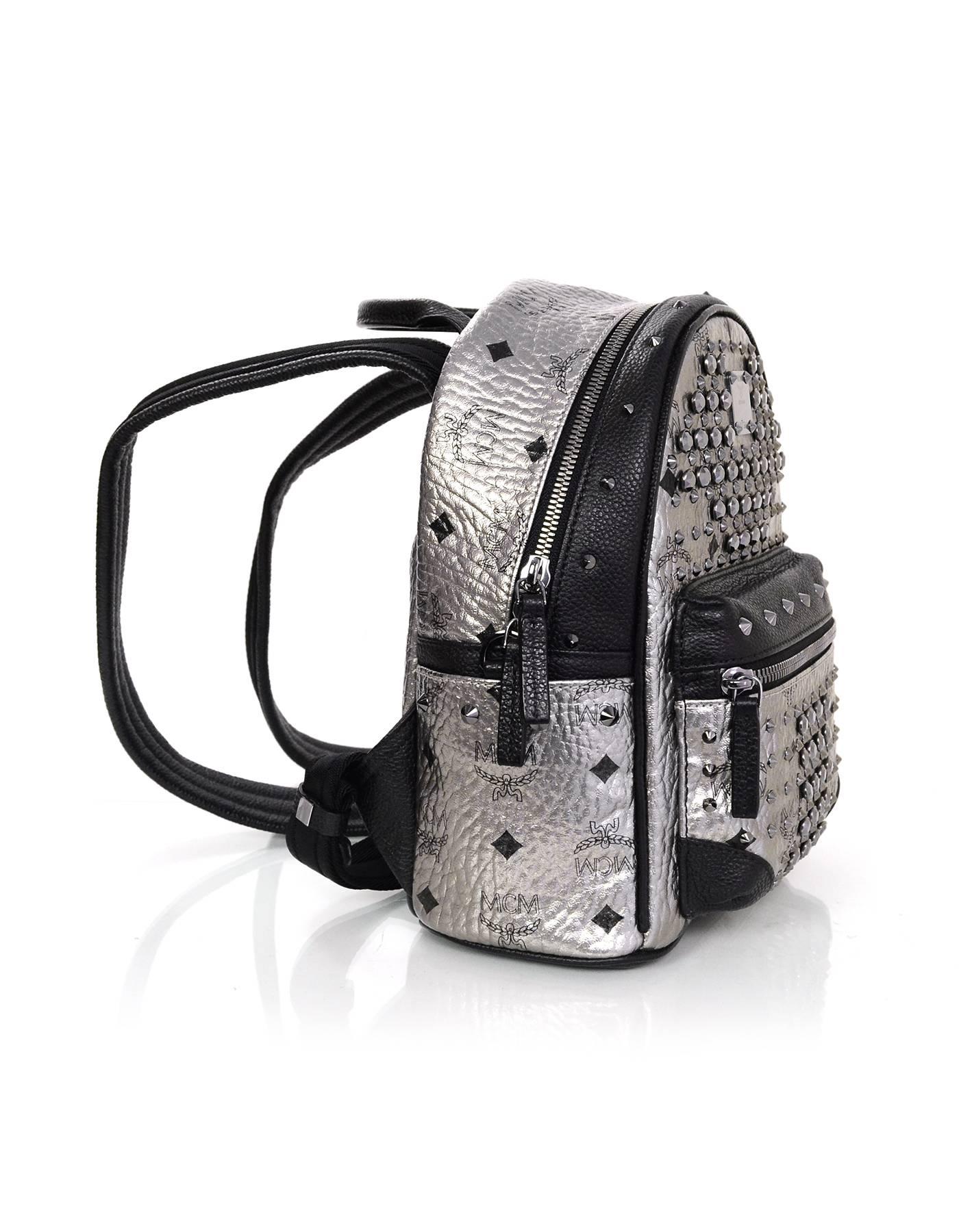 100% Authentic MCM Silver Monogram Crystal Studded Mini Backpack. Features silver canvas with MCM logo and black swarovski crystal studding throughout. Black leather trim and gunmetal hardware.

Made In: Korea
Color: Silver and black
Hardware: