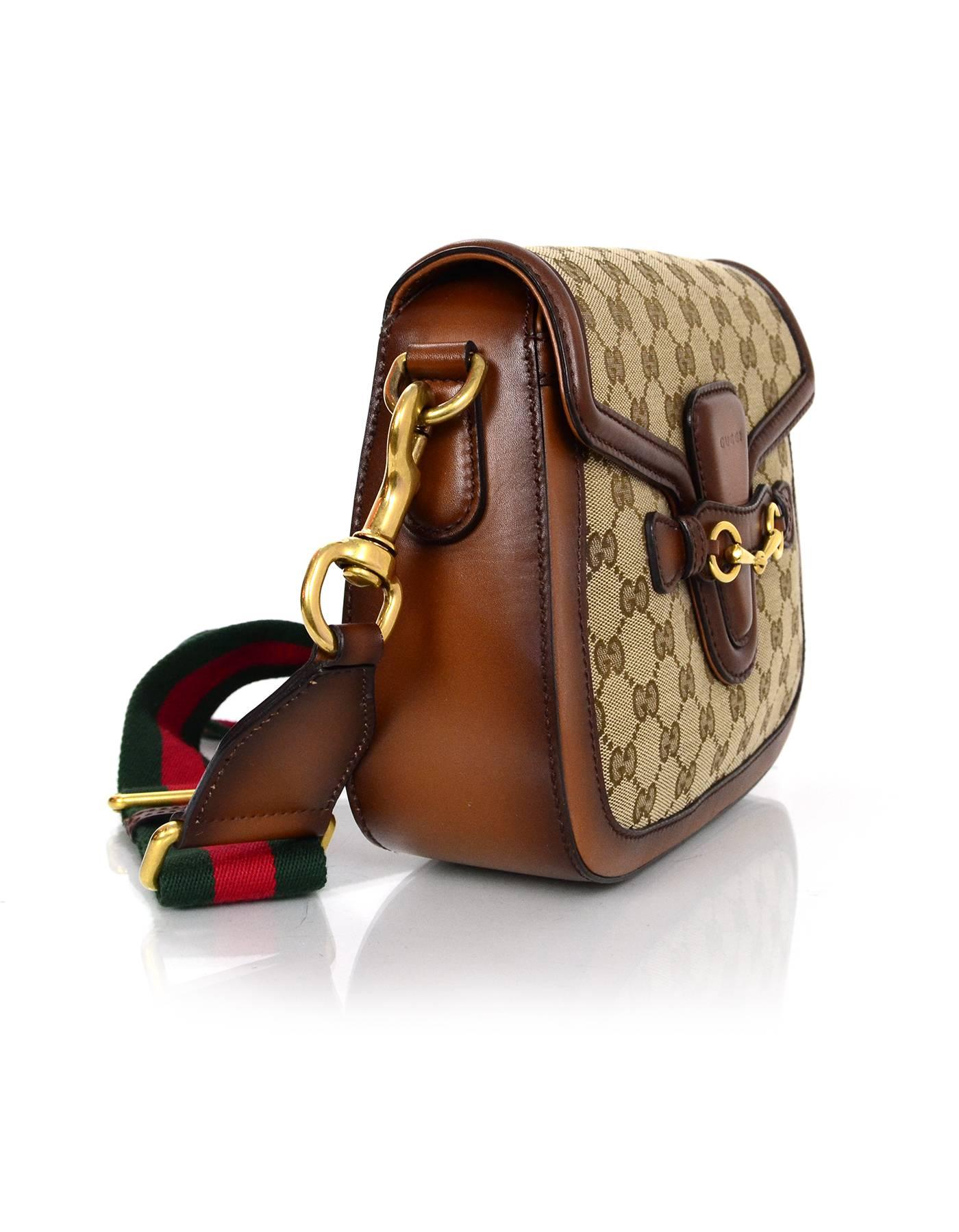 100% Authentic Gucci Brown Medium Lady Web Crossbody. Features brown stained leather trim with classic goldtone horsebit detail. Adjustable web red and green stripe strap allows bag to be worn on the shoulder or crossbody.

Made In: Italy
Color: