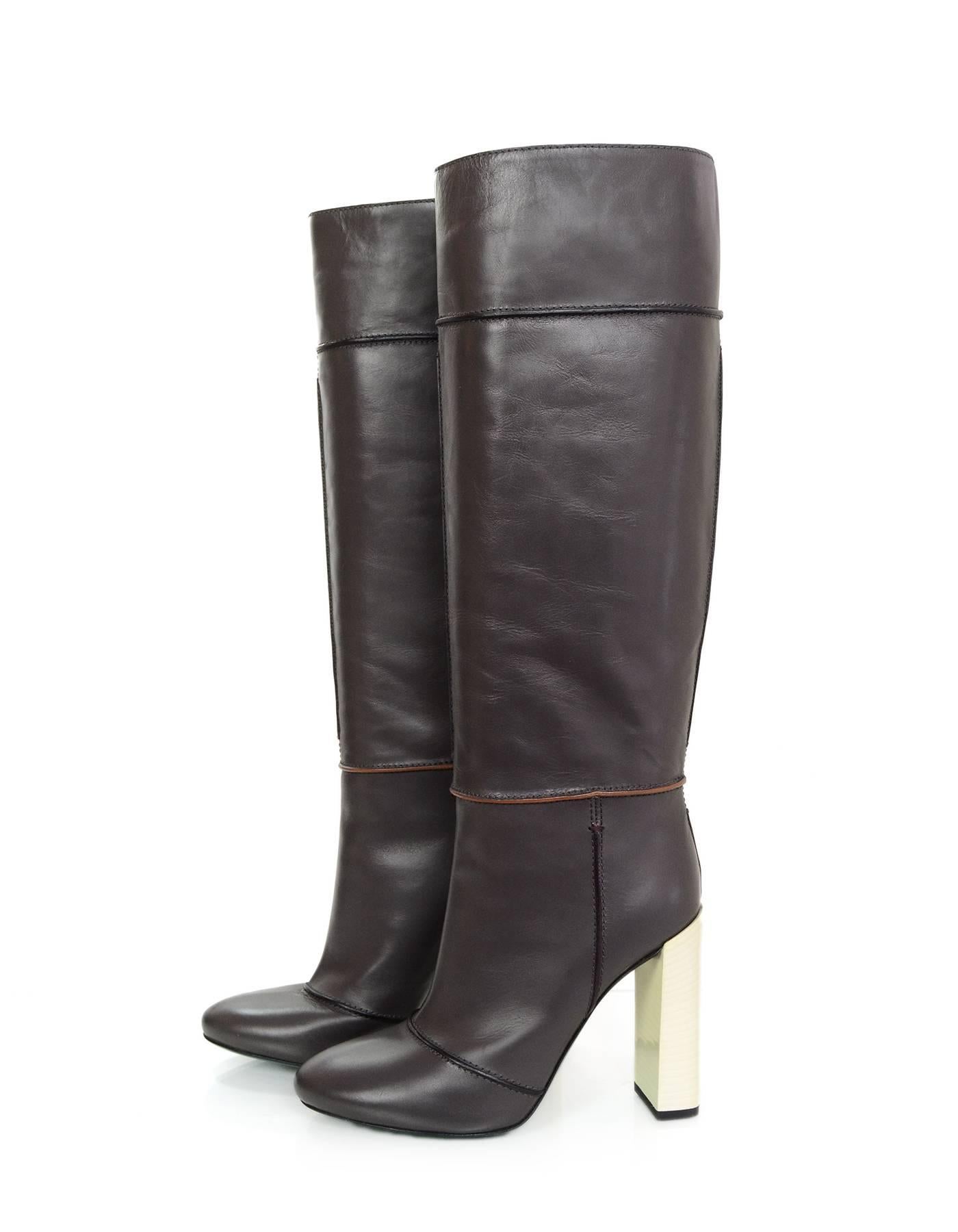 Fendi Grey Leather Mikado Knee High Boots 
Features white stacked heel and green soles

Made In: Italy
Color: Grey, white and green
Materials: Leather
Closure/Opening: Pull on
Sole Stamp: Fendi Made in Italy Vero Cuoio 39
Retail Price: $1,550 +