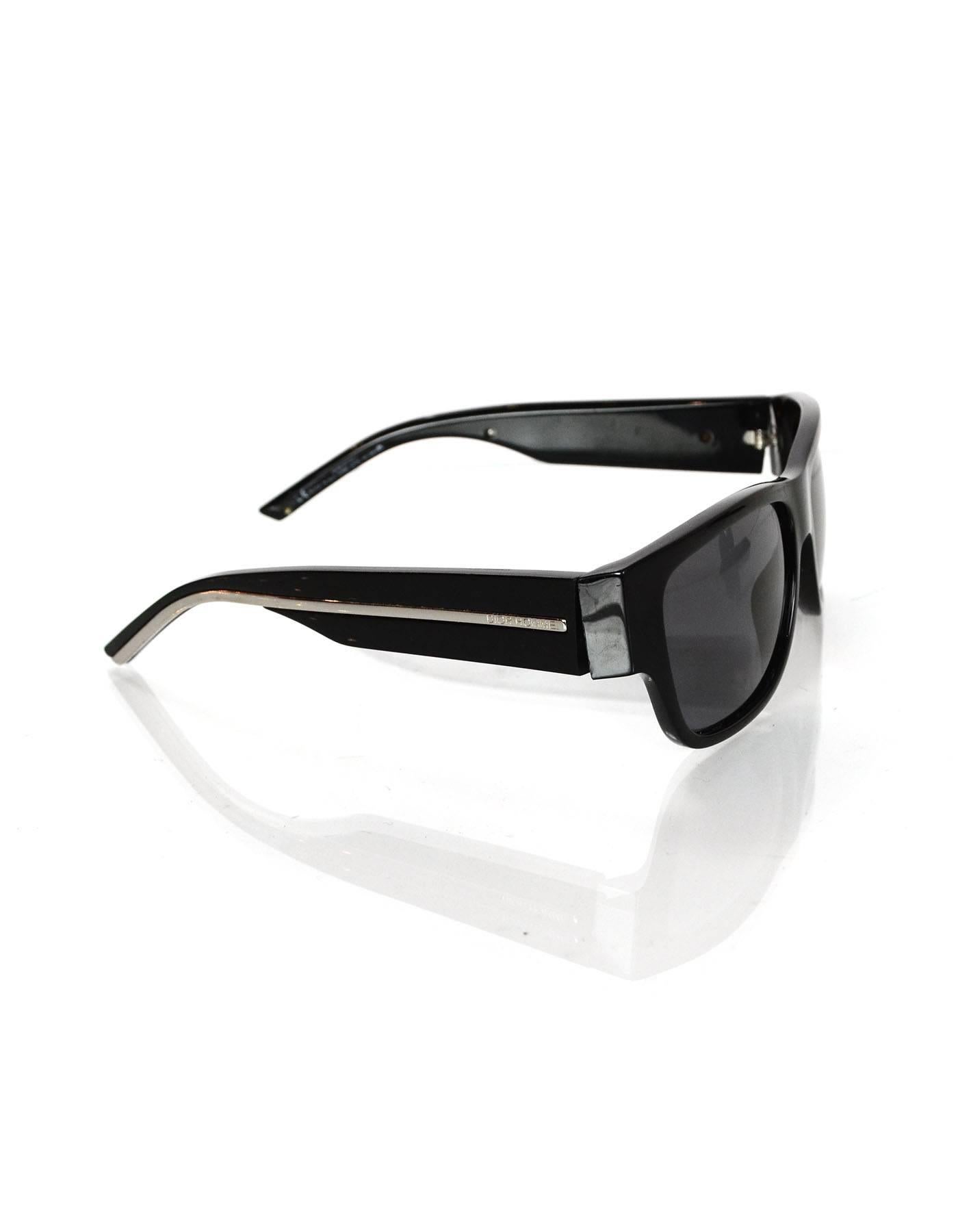 100% Authentic Dior Homme Black Sunglasses. Features silvertone stripe on the arms with logo. Rectangle shape. Very good pre-owned condition with the exception of misaligned arms.

Made In: Italy
Color: Black
Materials: Resin
Overall Condition: Very