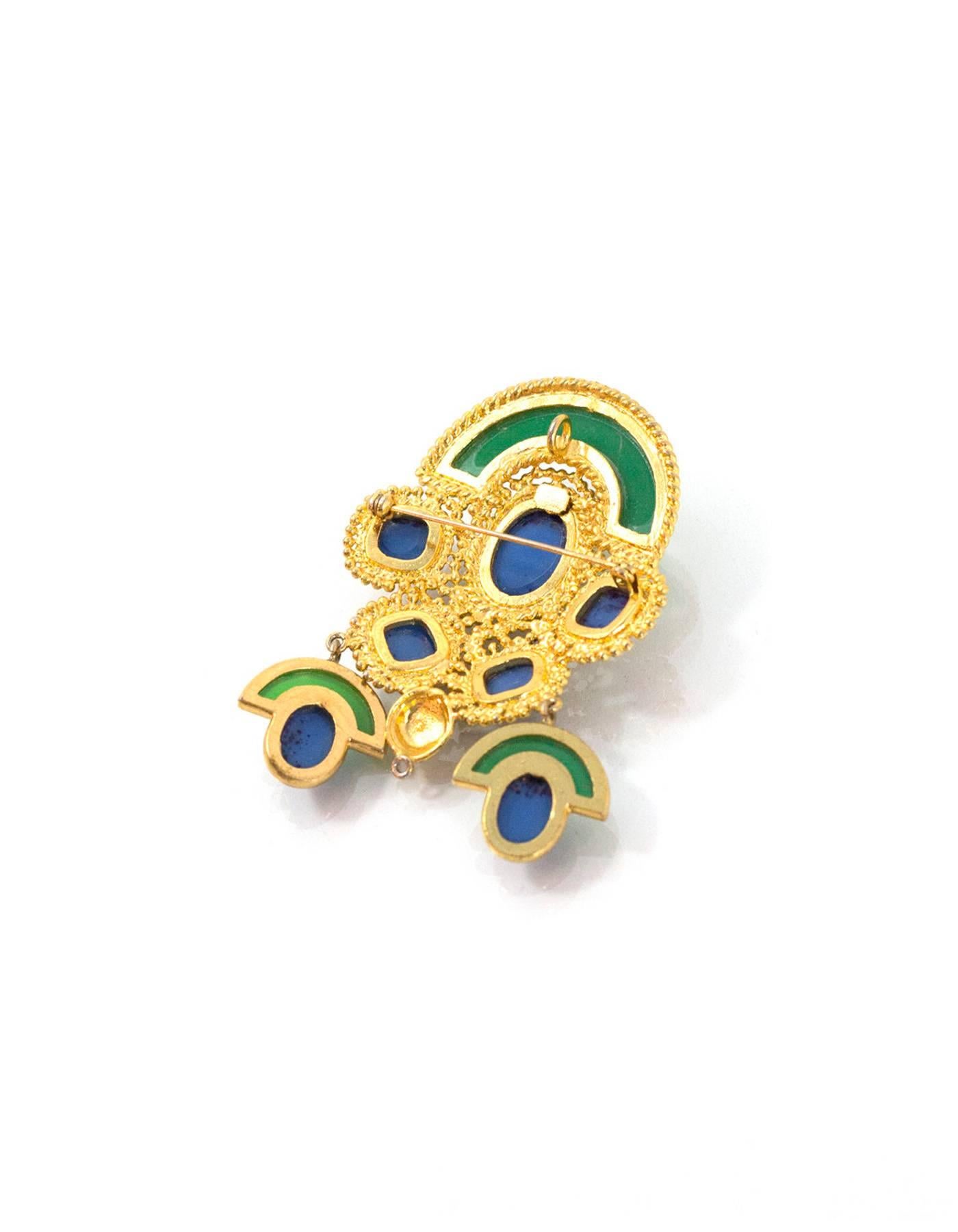 Christian Dior Vintage Gold Green & Lapis Brooch
Feaures two dangling pendants and has ring attached to back for wearing as a pendant on a necklace

Made In: Germany
Year of Production: 1971
Color: Goldtone green and blue
Materials: Metal,