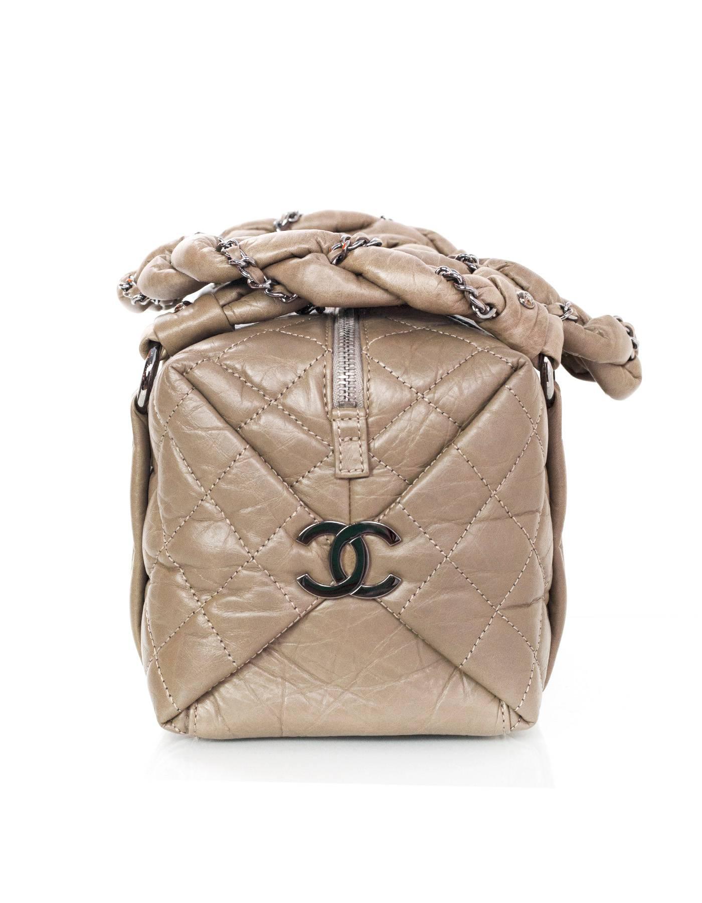 Chanel Etoupe Quilted Leather Lady Braid Bubble Bag 
Features leather woven chain link details wrapped around shoulder straps and two large CC pendants on both side panels of bag
Made In: Italy
Year of Production: 2006
Color: Taupe
Hardware: