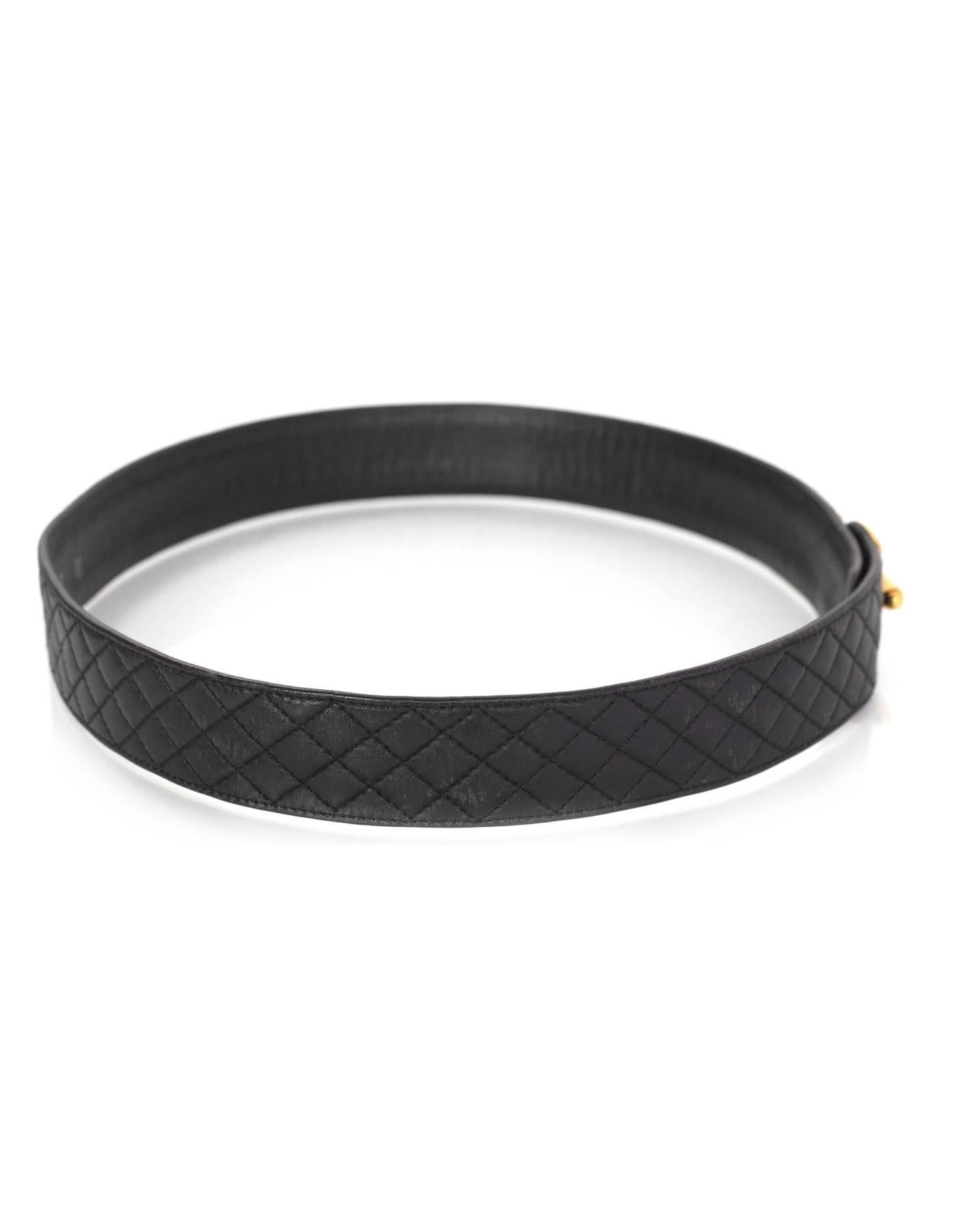 Chanel Black Quilted Leather Belt 
Features goldtone CC latch detail at front

Made In: France
Year of Production: 1994
Color: Black
Hardware: Goldtone
Materials: Leather
Closure/Opening: Snap button and front latch closure
Stamp: 94 CC P
Overall