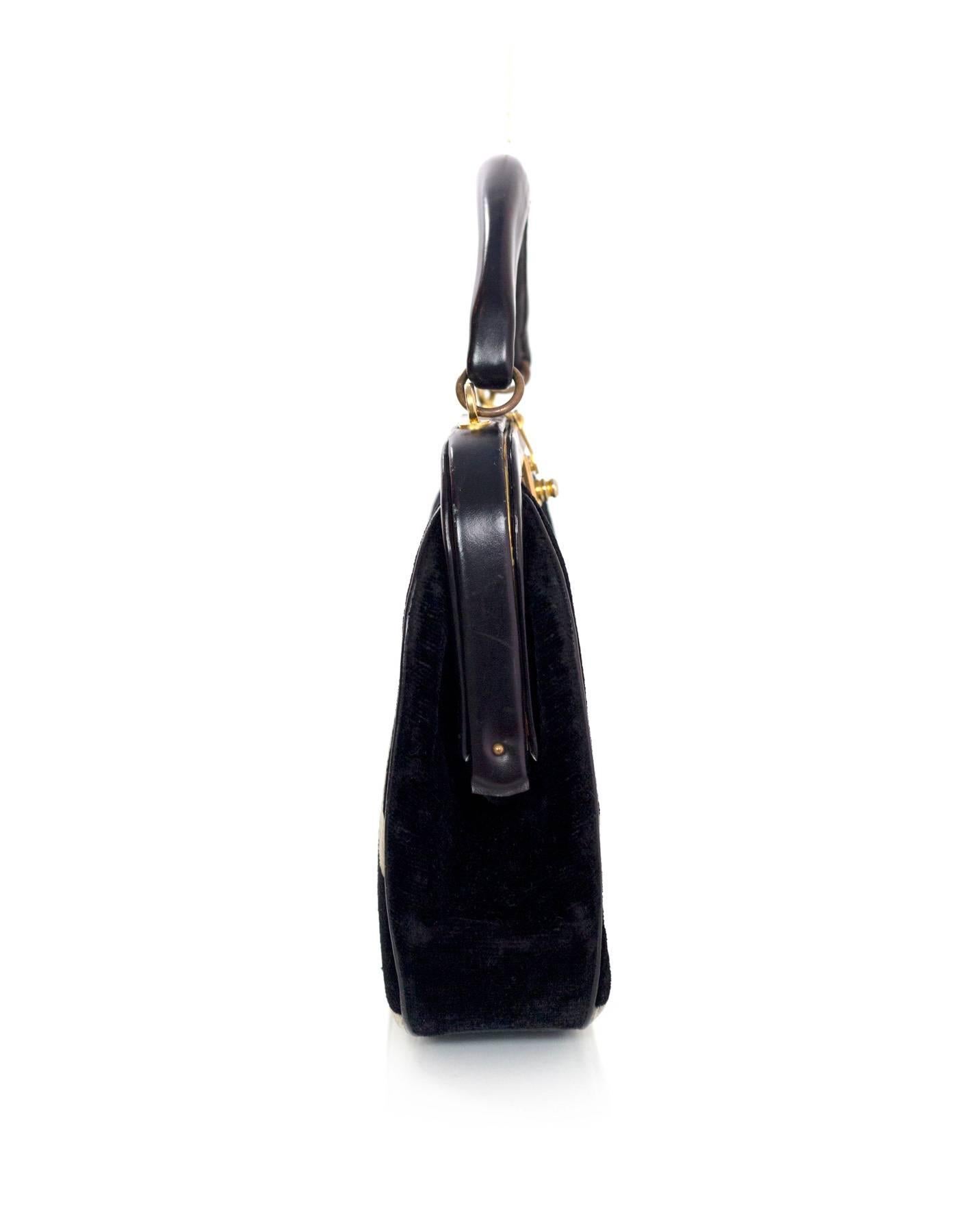 Roberta di Camerino Vintage Black Velvet Frame Bag
Features white velvet detail

Made In: Italy
Color: Black and white
Hardware: Goldtone
Materials: Velvet and leather
Lining: Black leather
Closure/Opening: Frame style opening with push