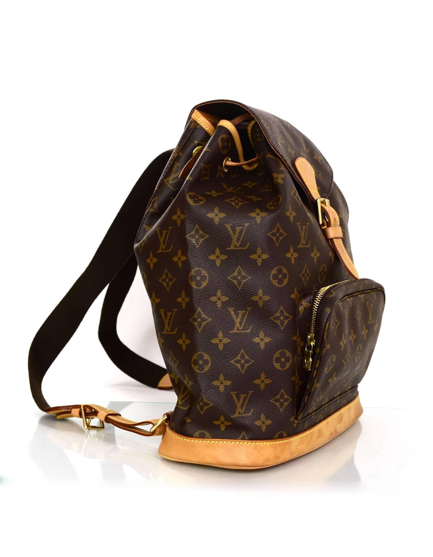 Louis Vuitton Monogram Montsouris GM Backpack 
Features leather trim throughout and adjustable shoulder straps

Made In: France
Year of Production: 2000
Color: Brown
Hardware: Goldtone
Materials: Leather and coated canvas
Lining: Brown