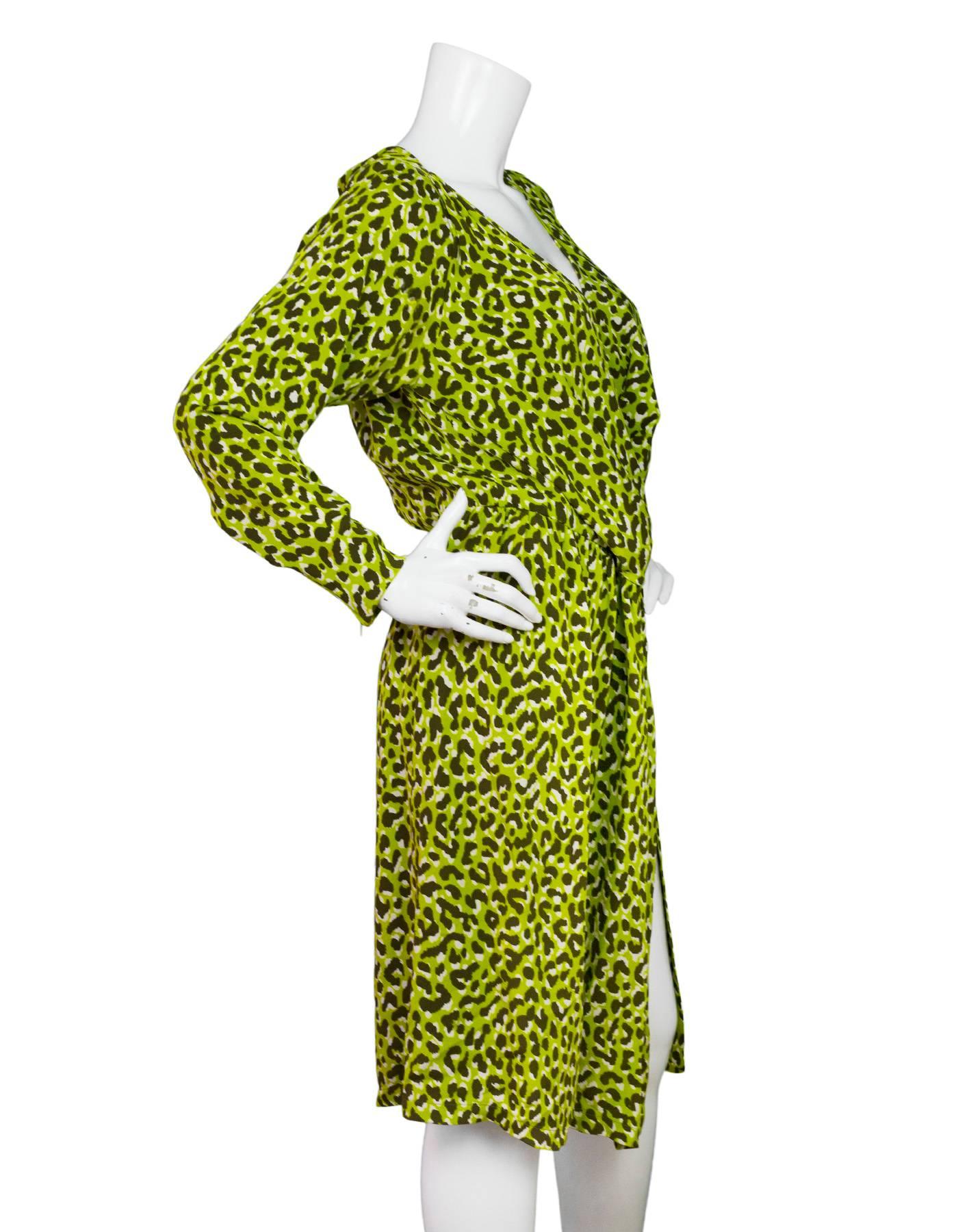 YSL Green & Brown Leopard Print Wrap Dress 

Made In: France
Color: Brown and green
Composition: 100% silk
Lining: None
Closure/Opening: Hidden waist snaps
Exterior Pockets: None
Interior Pockets: None
Overall Condition: Excellent pre-owned