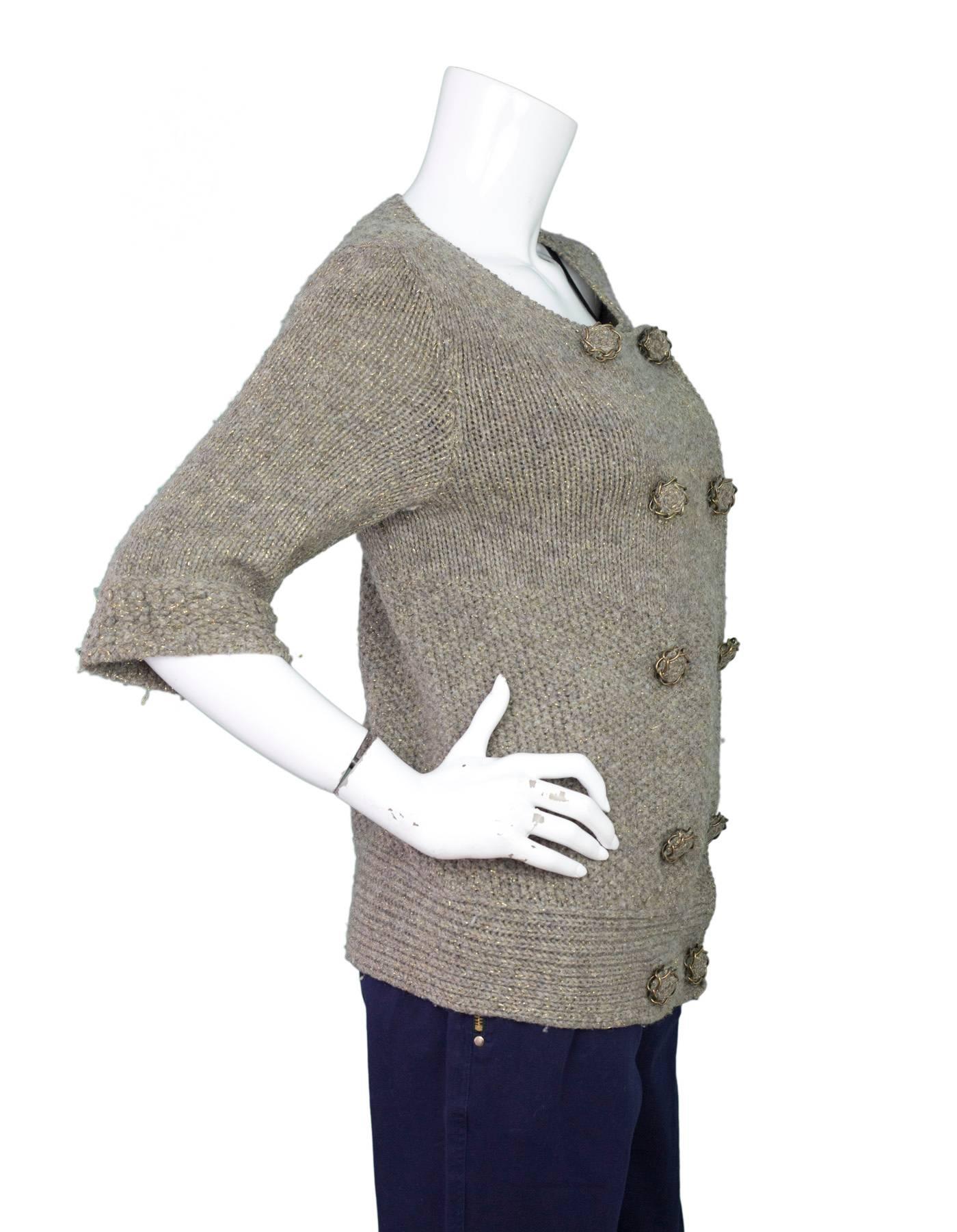 Louis Vuitton Metallic Taupe Wool Sweater 
Features chain link detailing on buttons 

Made In: Italy
Color: Taupe with metallic threading
Composition: 96% wool, 2% polyamide, 2% polyester
Lining: None
Closure/Opening: Double breasted snap button