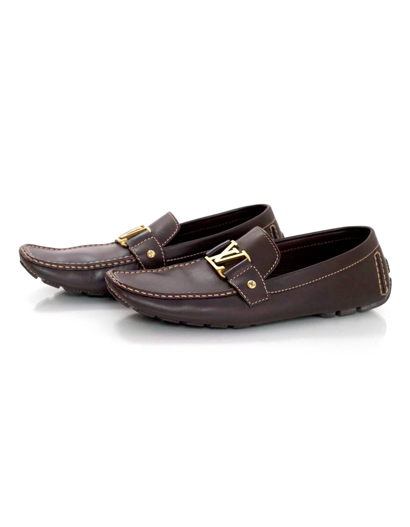 Louis Vuitton Men's Brown Leather Monte Carlo Car Shoes 
Features goldtone LV at top of shoe tongue

Made In: Italy
Year of Production: 2006
Color: Brown
Materials: Calf leather
Closure/Opening: Slide on
Sole Stamp: Louis Vuitton
Insole Stamp: FA