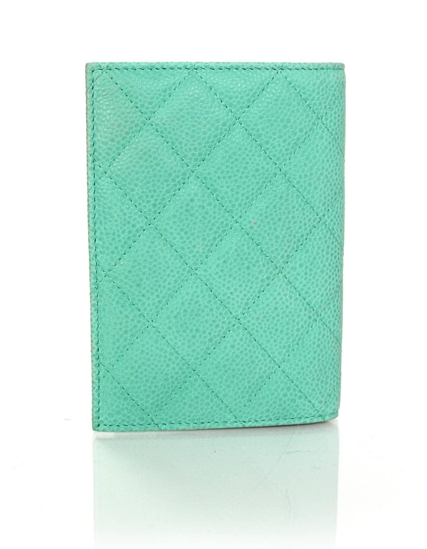 100% Authentic Chanel Green Iridescent Caviar Quilted Passport Holder 

Made in: Italy
Year of Production: 2013
Color: Seafoam green
Hardware: Silvertone
Materials: Iridescent caviar leather, suede-like
Lining: Seafoam green leather and