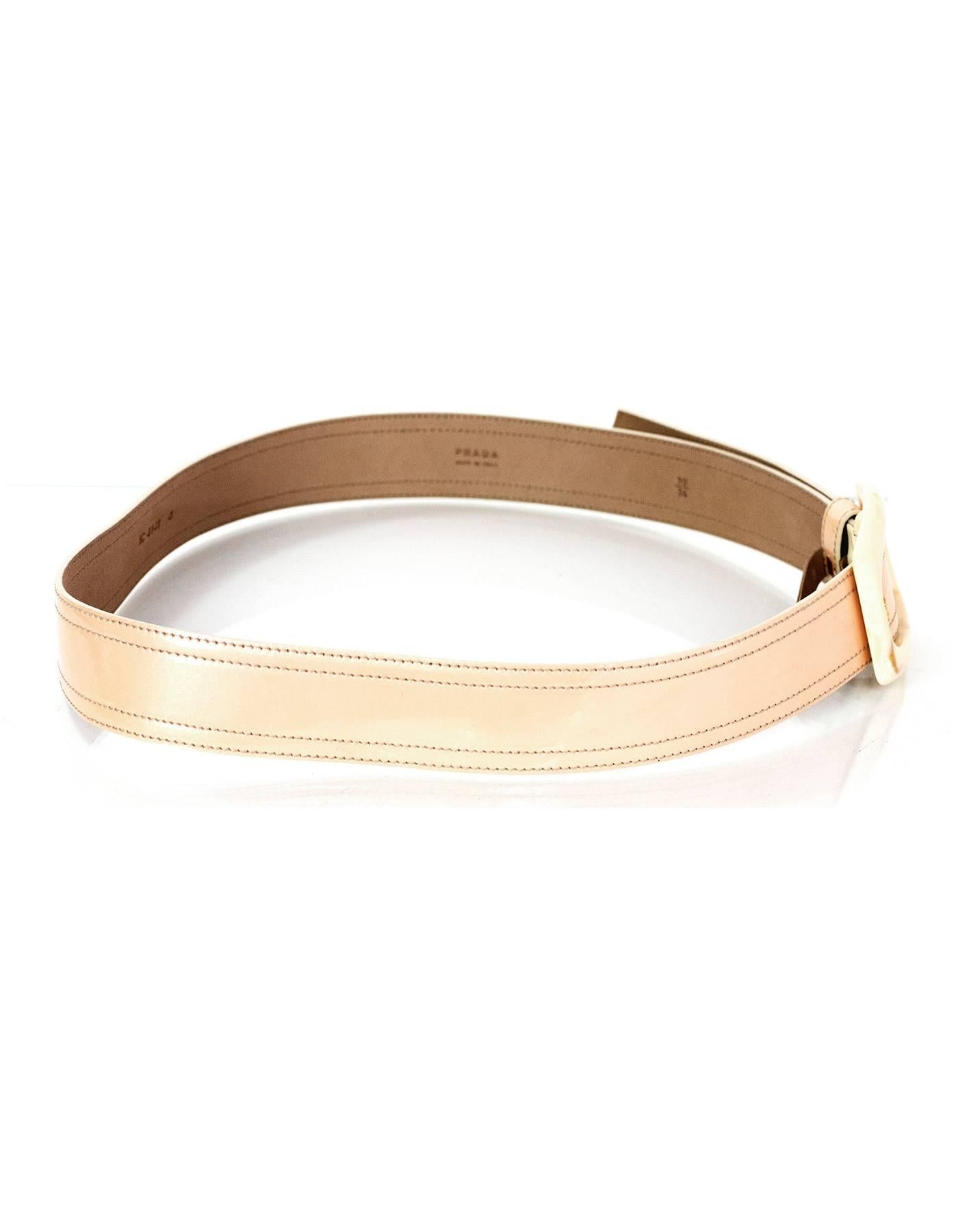 Prada Beige & Cream Patent Ombre Belt 
Features resin marble-style detailing on buckle

Made In: Italy
Color: Cream to beige ombre
Materials: Patent leather and resin
Closure/Opening: Buckle and notch closure
Stamp: 1C 4141 4
Overall Condition: