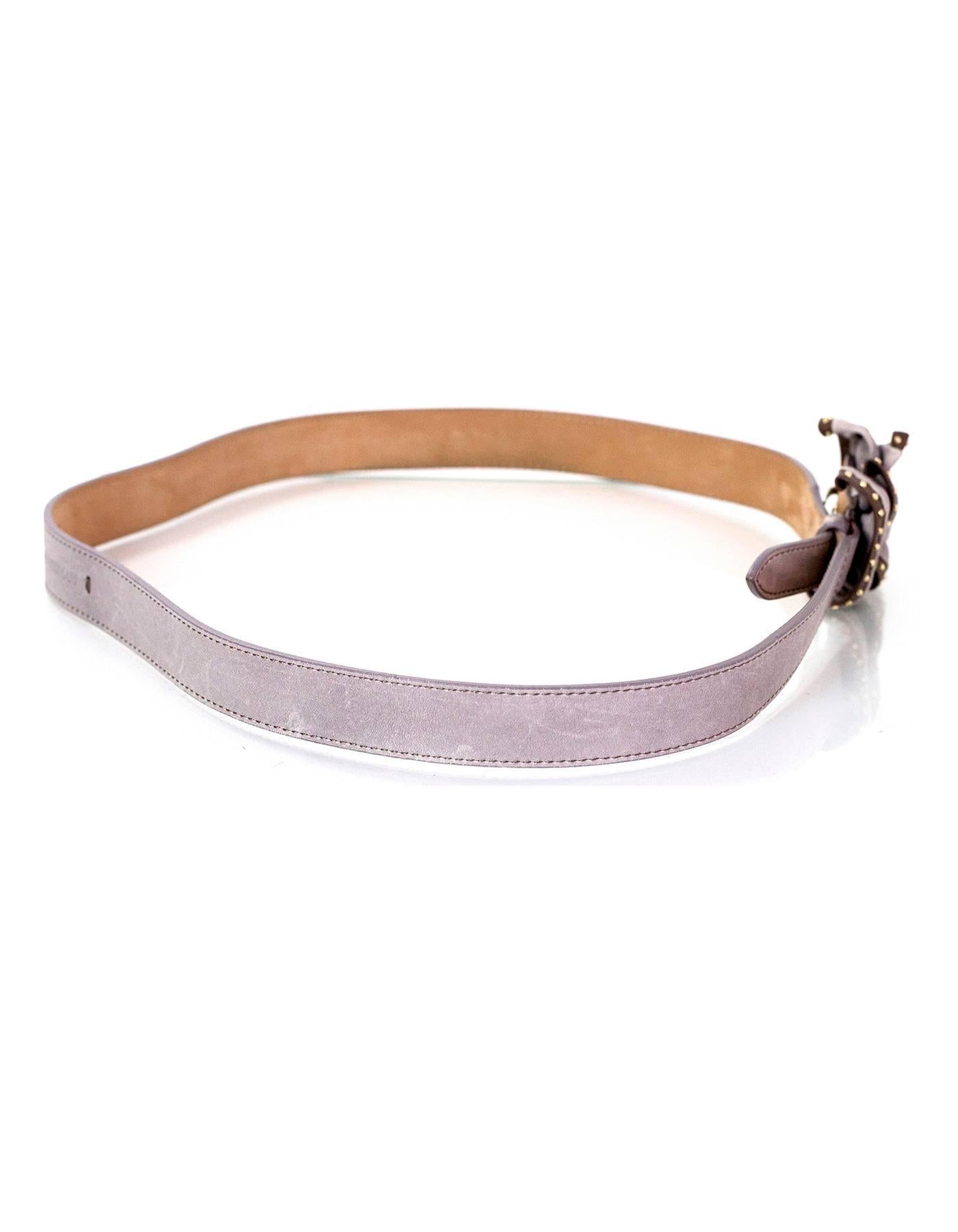 Emporio Armani Grey Leather Belt 
Features grey and taupe bow at buckle with goldtone studs

Made In: Italy
Color: Grey and taupe
Materials: Leather
Closure/Opening: Hook closure
Stamp: Genuine Leather YEW E83
Overall Condition: Excellent pre-owned