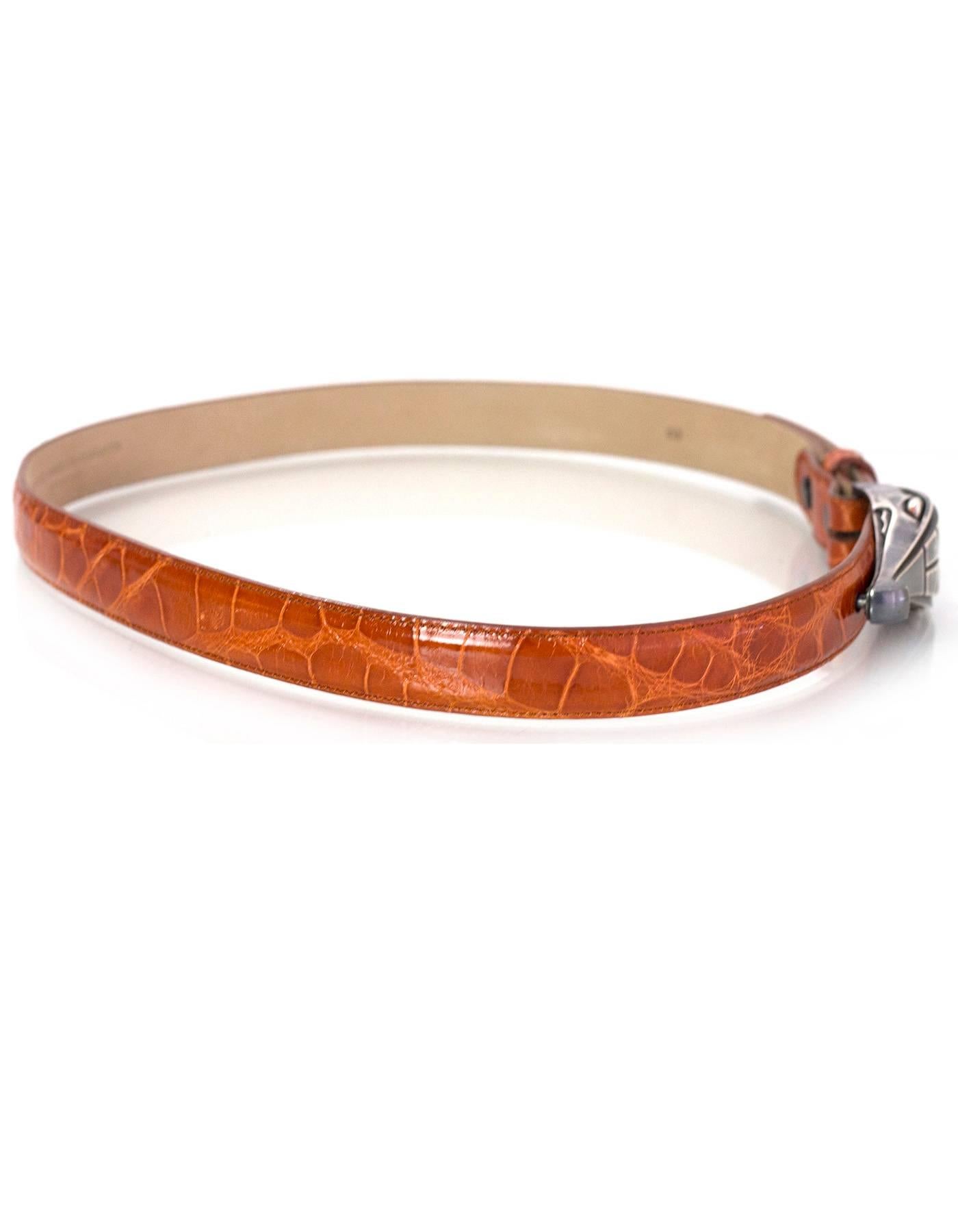 Barry Kieselstein-Cord Tan Alligator Belt 
Features sterling silver alligator head belt buckle

Made In: Italy
Year of Production: 2001
Color: Tan and silver
Materials: Alligator and sterling silver
Closure: Buckle and notch closure
Stamp: