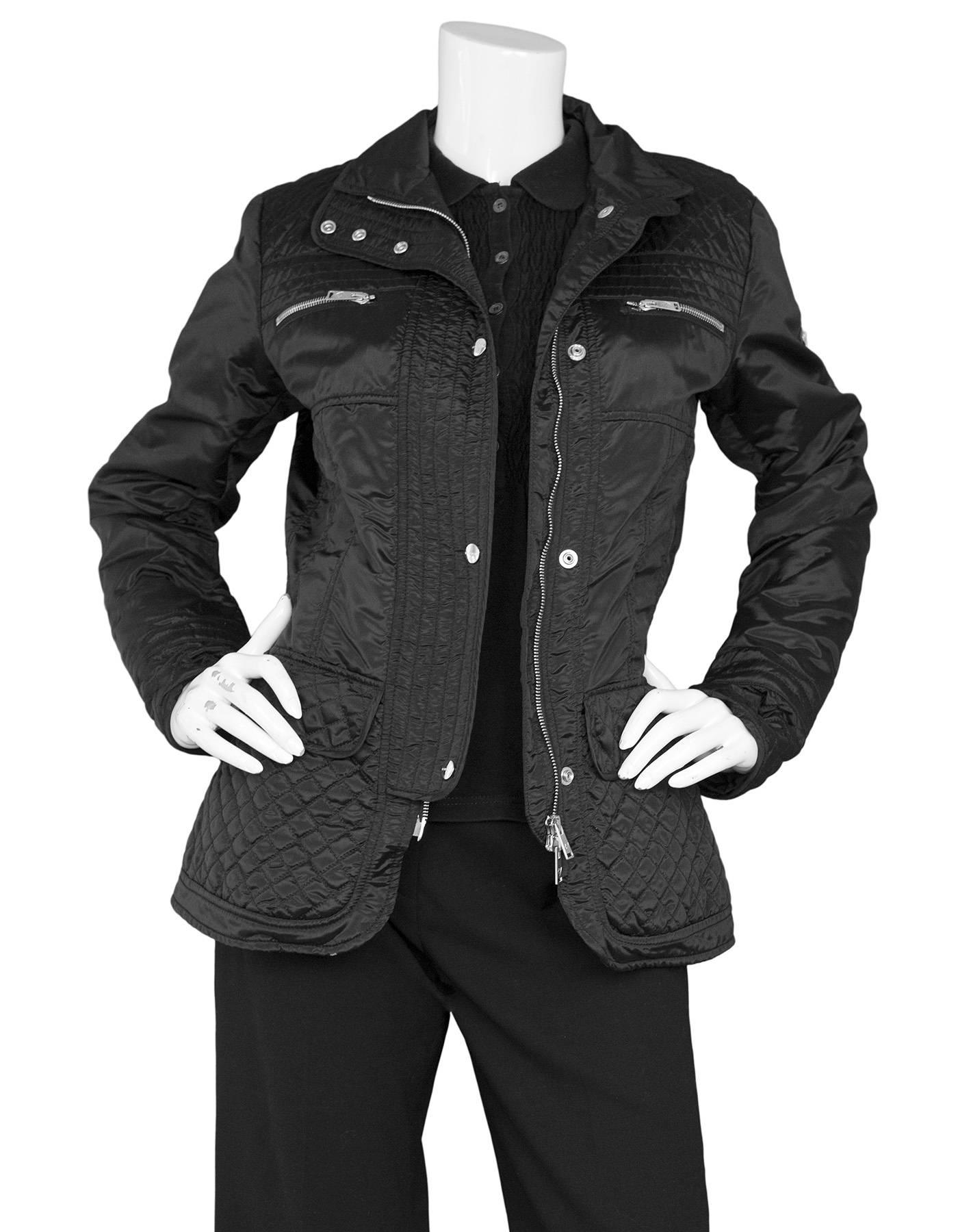 Postcard Black Nylon Quilted Jacket 

Made In: Romania
Color: Black
Composition: Polyamide
Lining: Black, 100% polyamide
Closure/Opening: Double zip up closure
Exterior Pockets: Two flap pockets and two zipper pockets
Interior Pockets: None
Overall