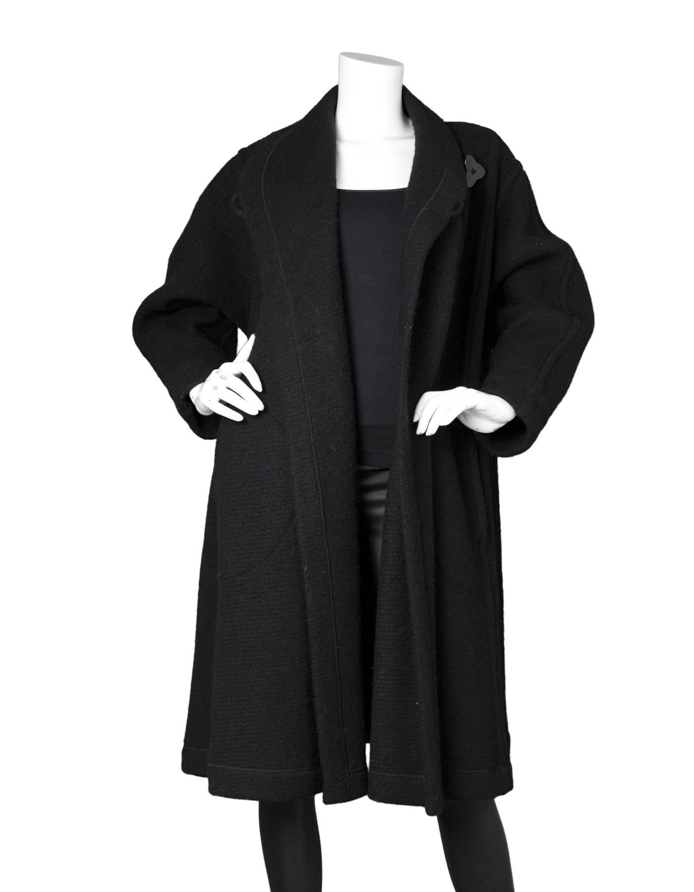 Missoni Vintage Black Wool Swing Coat 
Features wrap-style closure

Made In: Italy
Color: Black
Composition: Not given- believed to be a wool blend
Lining: None
Closure/Opening: Two wrap-style collar line buttons
Exterior Pockets: Two hip