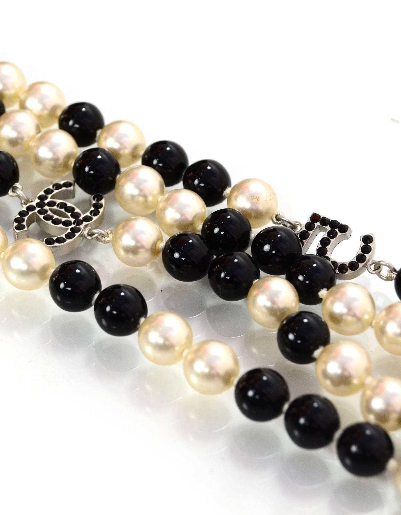 Chanel Pearl & Beaded Long Charm Necklace
Features black crystal CC, number 5, and four leaf clover pendants throughout

Made In: France
Year of Production: 2005
Color: Black and ivory
Hardware: Silvertone
Materials: Metal, faux pearl, crystal