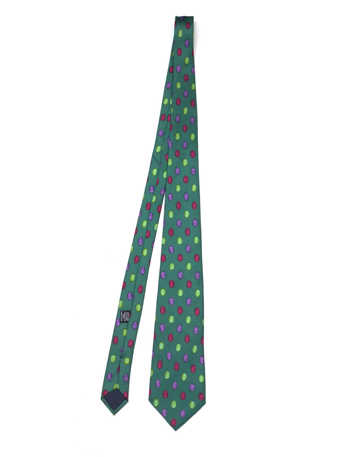 Chanel Green & Multi-Color Dot Print Silk Tie

Made In: Italy
Color: Green, purple, red, and light green
Composition: 100% silk
Overall Condition: Excellent pre-owned condition with the exception of a few small pulls throughout tie
Measurements: