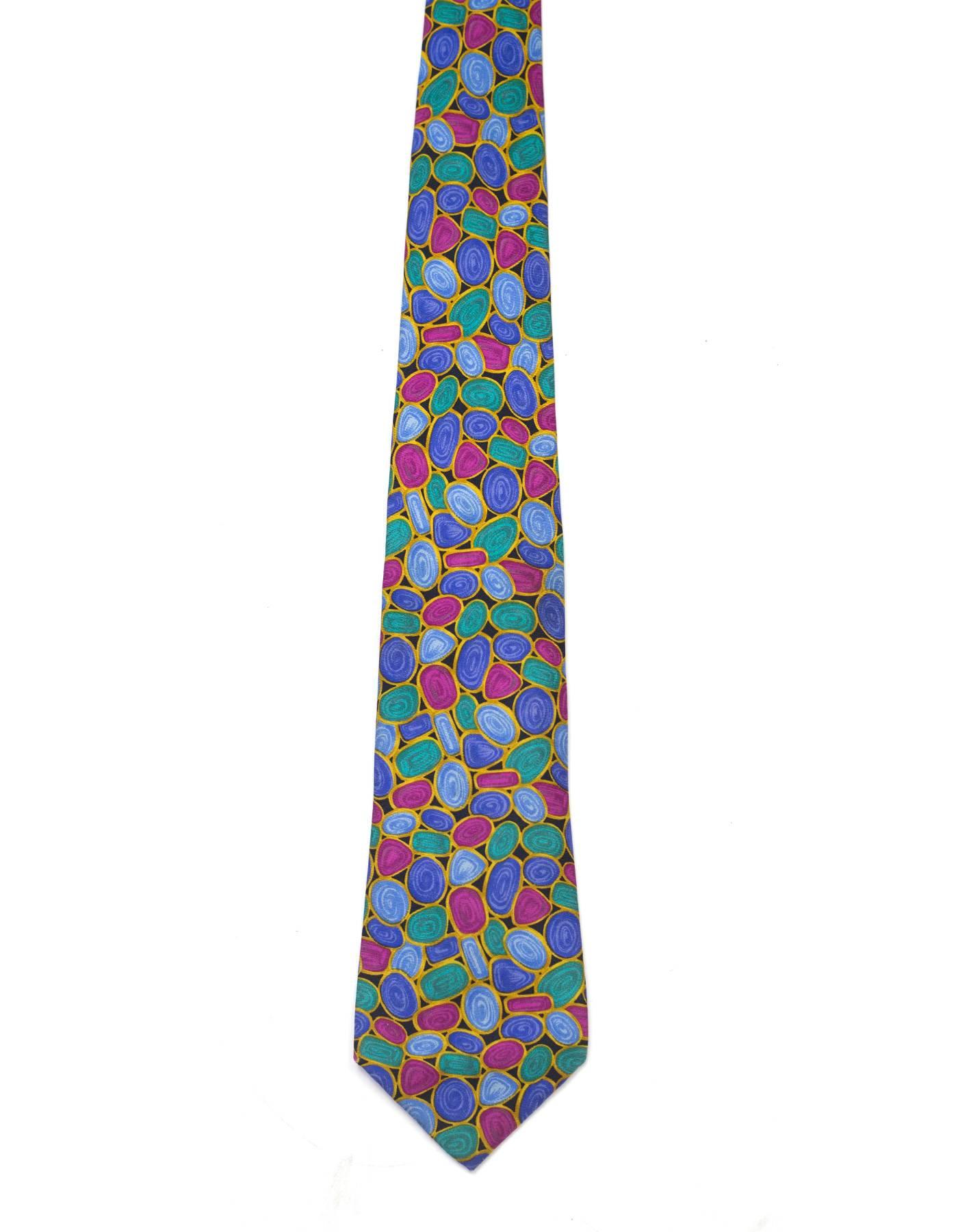 Chanel Multi-Color Jewel Print Silk Tie 

Made In: Italy
Color: Black, blue, gold, green, purple and magenta
Composition: 100% silk
Overall Condition: Excellent pre-owned condition
Measurements: 
Length: 58.5"
Width: 2"-3.5"