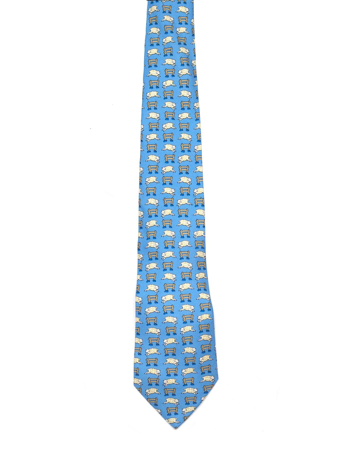 Hermes Baby Blue & White Sheep Print Silk Tie
Features sheep jumping over fence printed throughout tie

Made In: France
Color: Baby blue and white
Composition: 100% silk
Overall Condition: Excellent pre-owned condition with the exception of a