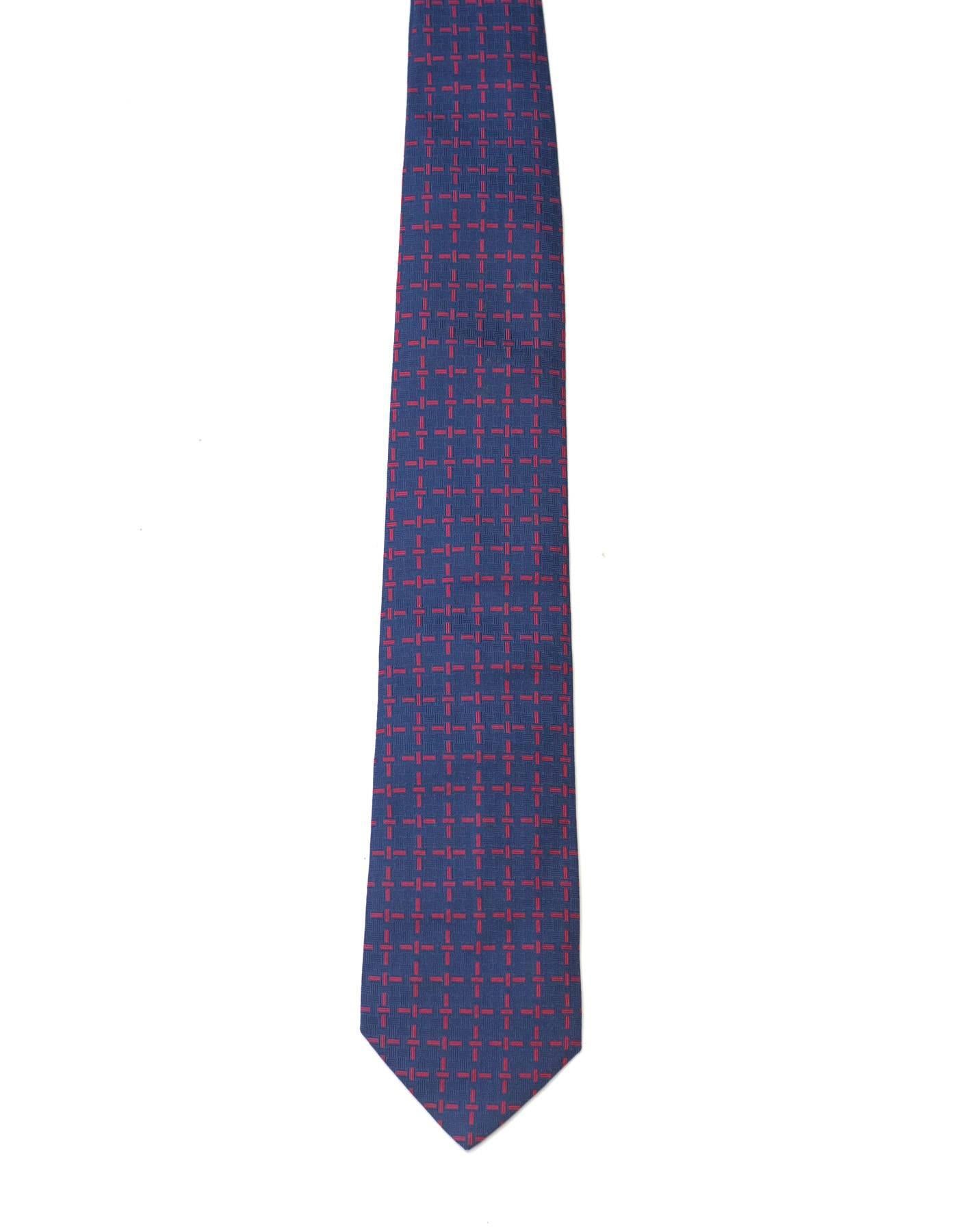 Hermes Navy & Red Stitch Print Silk Tie

Made In: France
Color: Navy and red
Composition: 100% silk
Overall Condition: Excellent pre-owned condition with the exception of some faint soiling on one patch of tie
Measurements: 
Length: