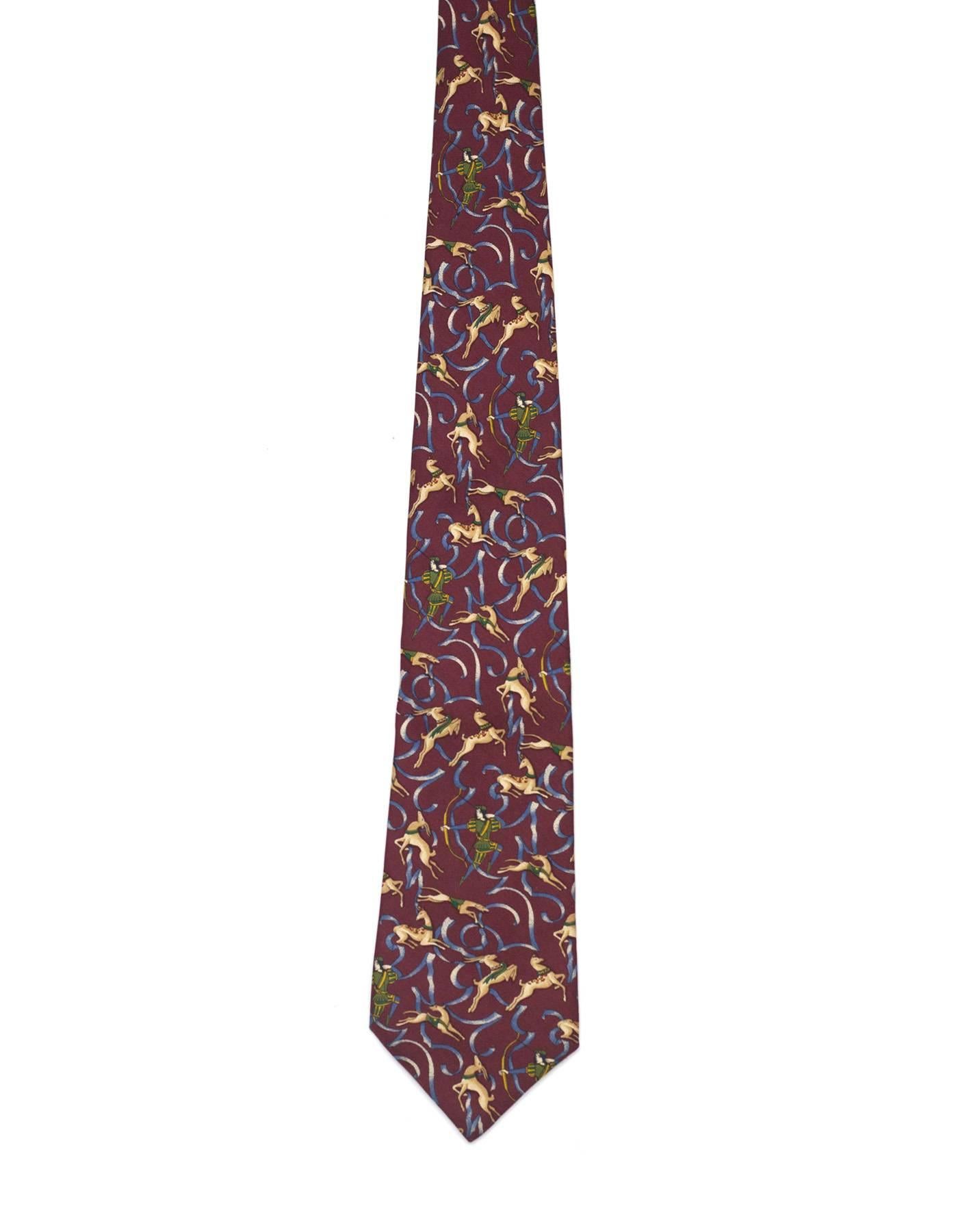 Salvatore Ferragamo Burgundy Deer Hunting Print Silk Tie
Features man with bow & arrow, deer and dogs printed throughout
Made In: Italy
Color: Burgundy, beige and green
Composition: 100% silk
Overall Condition: Excellent pre-owned condition