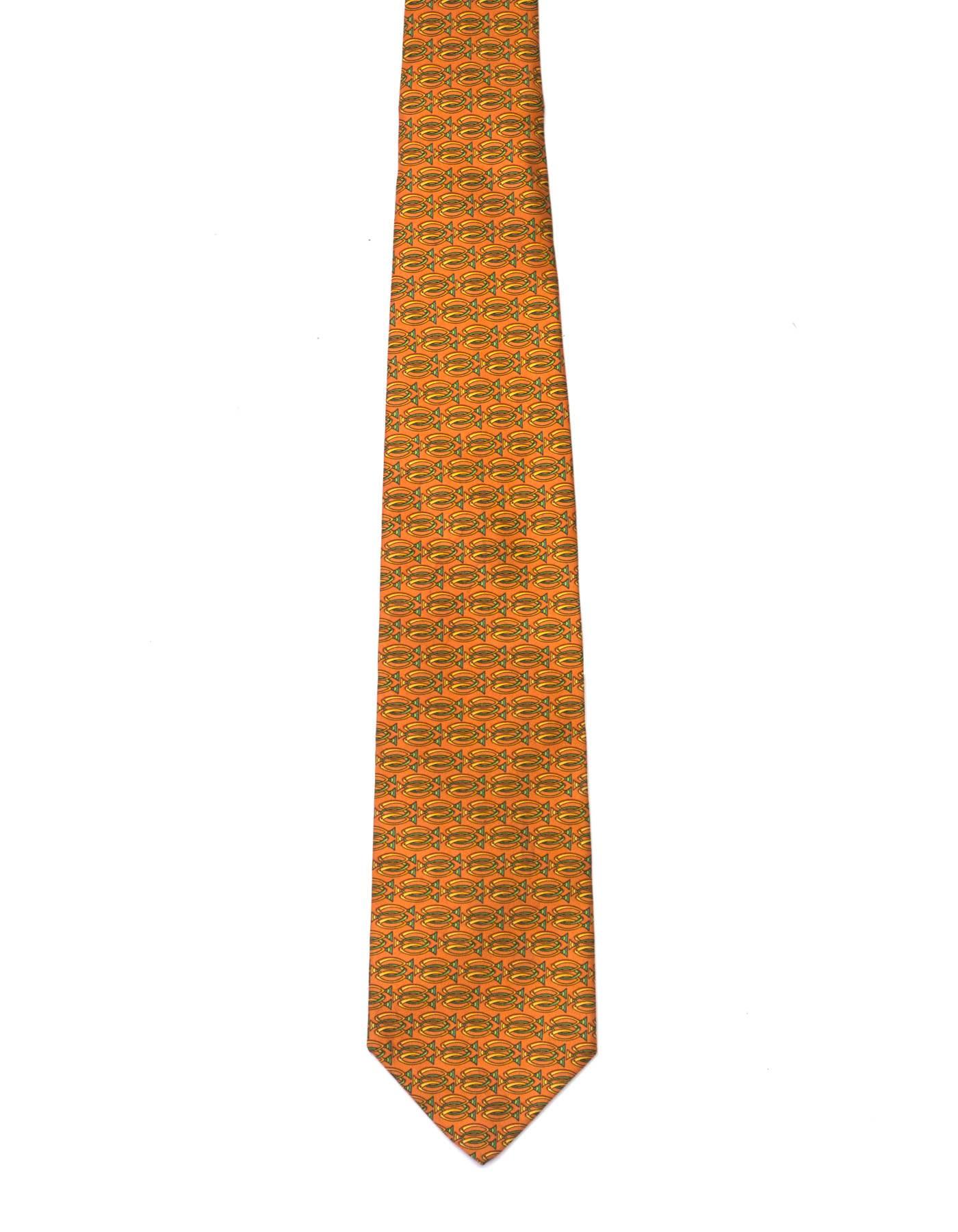 Salvatore Ferragamo Orange Fish Print Silk Tie
Features lime green ribbon printed at bottom with logo on top

Made In: Italy
Color: Orange
Composition: 100% silk
Overall Condition: Excellent pre-owned condition
Measurements: 
Length: