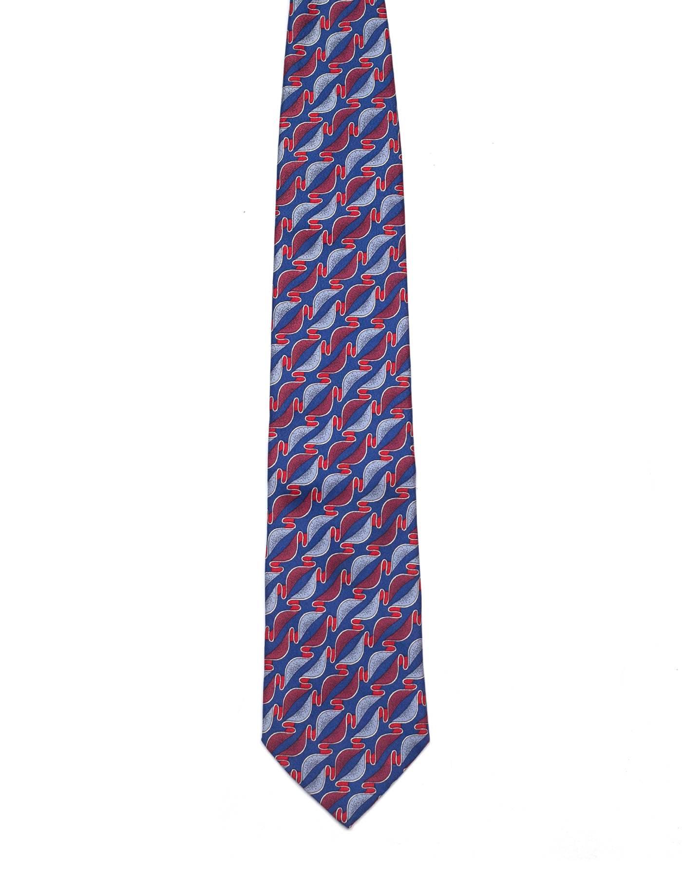 Bottega Veneta Blue & Red Printed Silk Tie
Features ribbon printed throughout

Made In: Italy
Color: Red and blue
Composition: 100% silk
Overall Condition: Excellent pre-owned condition
Measurements: 
Length: 55.5"
Width: