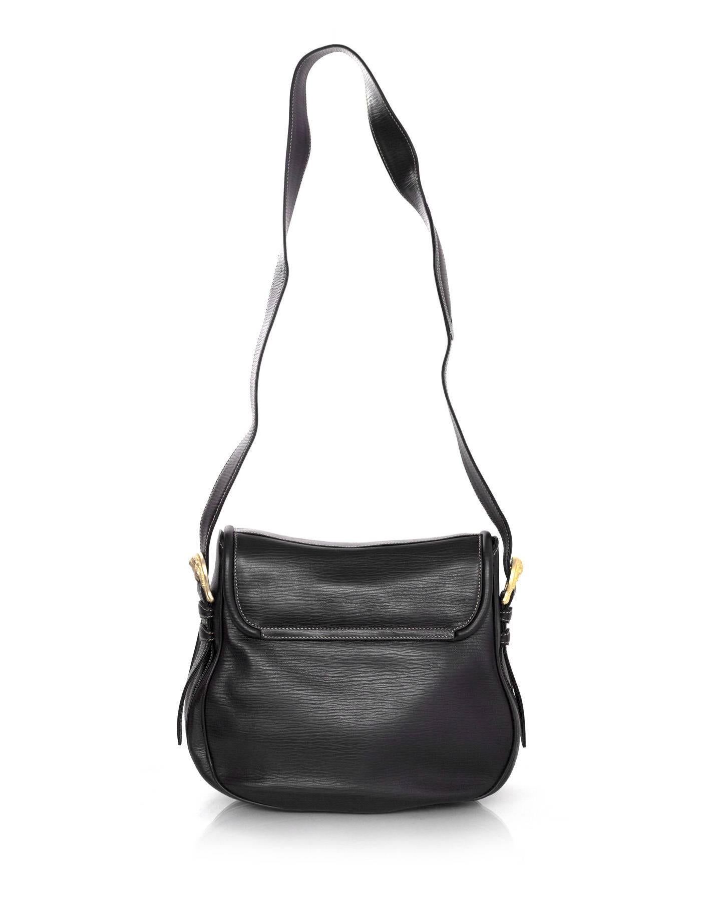 Barry Kieselstein-Cord Black Leather Saddle Bag
Features matte pale goldtone squirrel and acorn at flap top closure

Made In: Italy
Year of Production: 1995
Color: Black
Hardware: Matte pale goldtone
Materials: Leather
Lining: Green