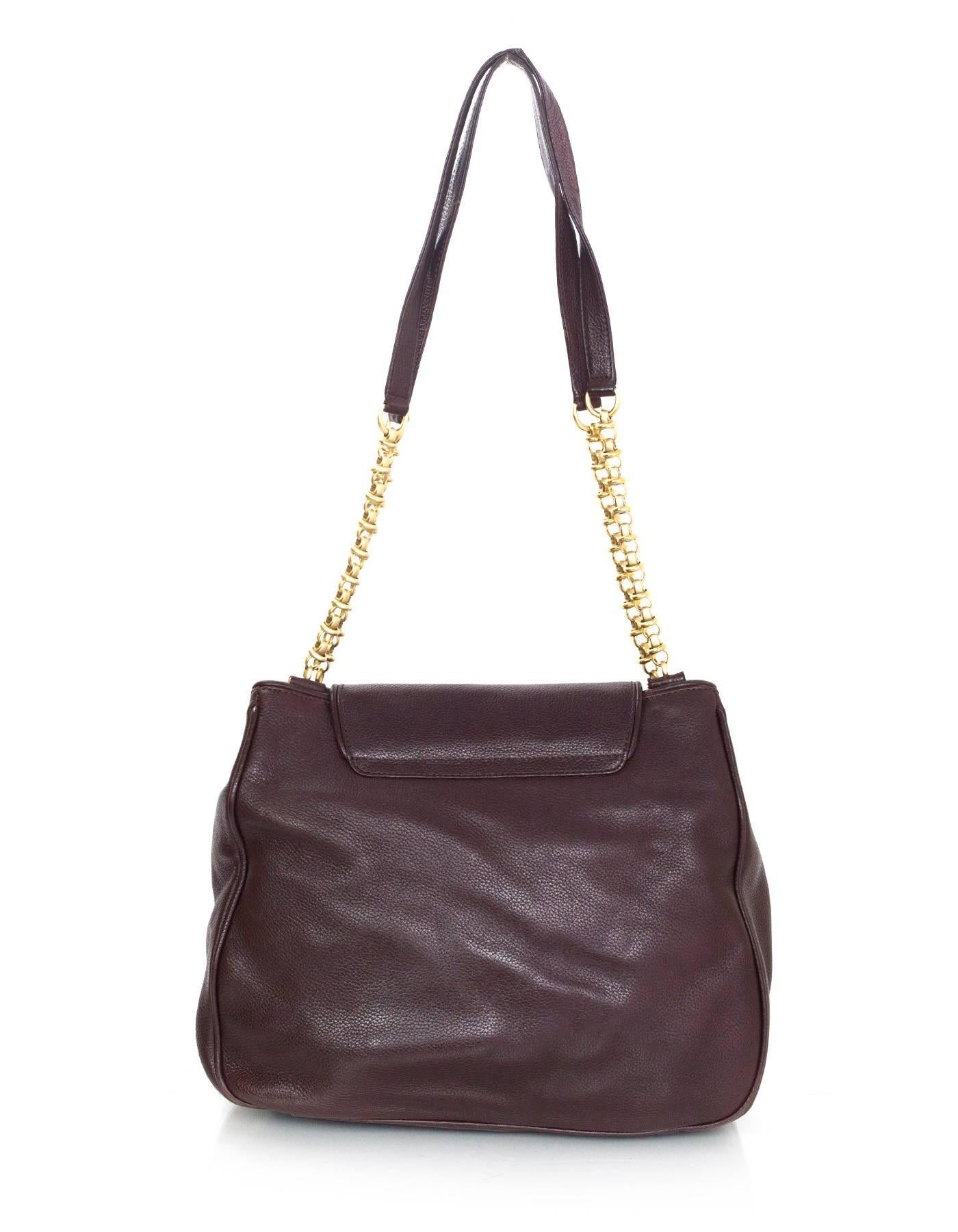 Barry Kieselstein-Cord Brown Leather Shoulder Bag 
Features matte pale goldtone frog and ladybug detail at closure

Made In: Italy
Year of Production: 1995
Color: Brown
Hardware: Matte pale goldtone
Materials: Leather
Lining: Green