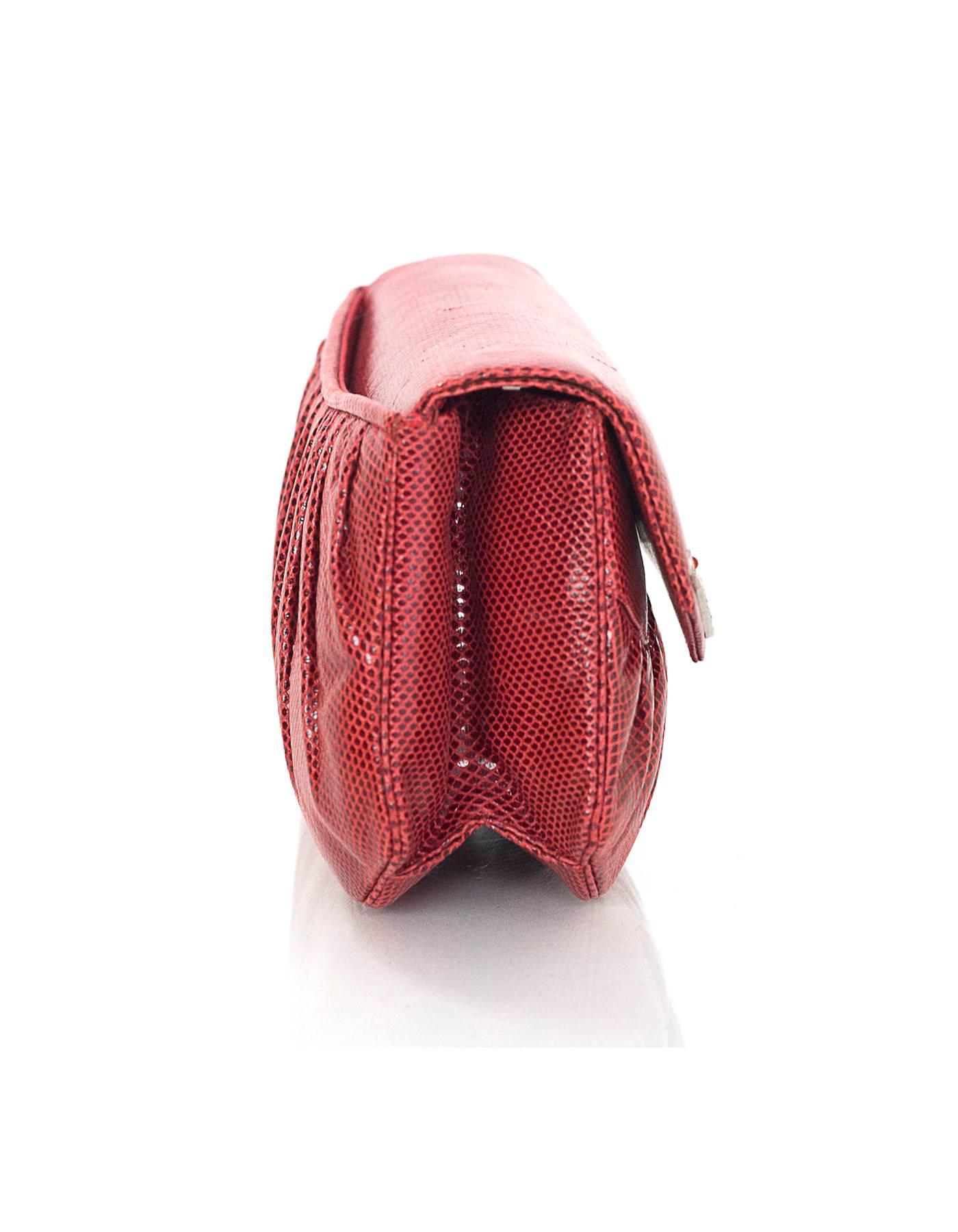 Judith Leiber Red Lizard Evening Bag 
Features detachable shoulder strap and crystal detailing at flap top opening

Color: Red
Hardware: Silvertone
Materials: Lizard skin
Lining: Red grosgrain
Closure/Opening: Flap top with magnetic snap