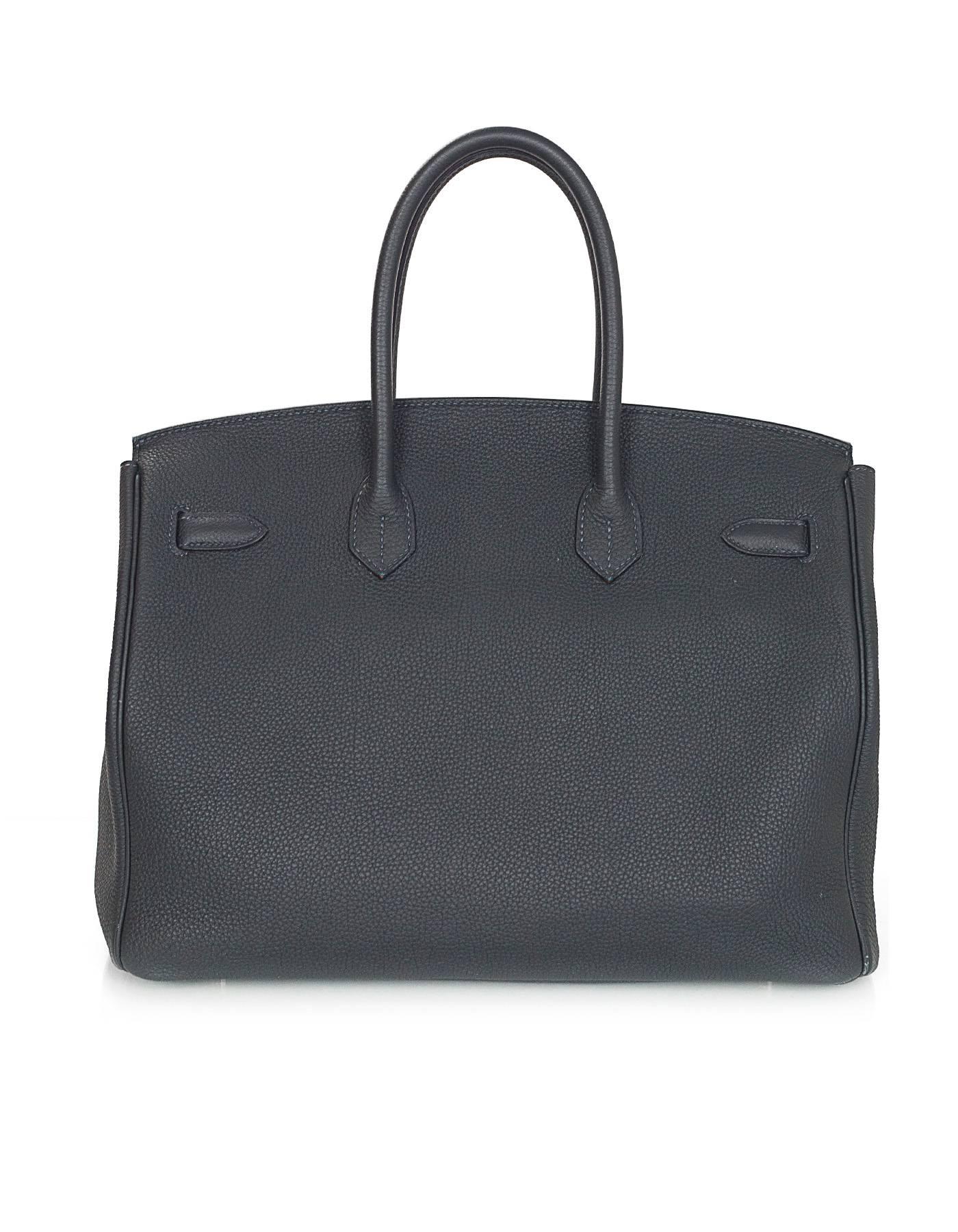 Hermes Bleu Obscur Togo Leather 35cm Birkin Bag
**NOTE: Leather has an odor due to issue in manufacturing process during this specified year**

Made In: France
Year of Production: 2013
Color: Bleu obscur (dark teal)
Hardware: Goldtone
Materials: