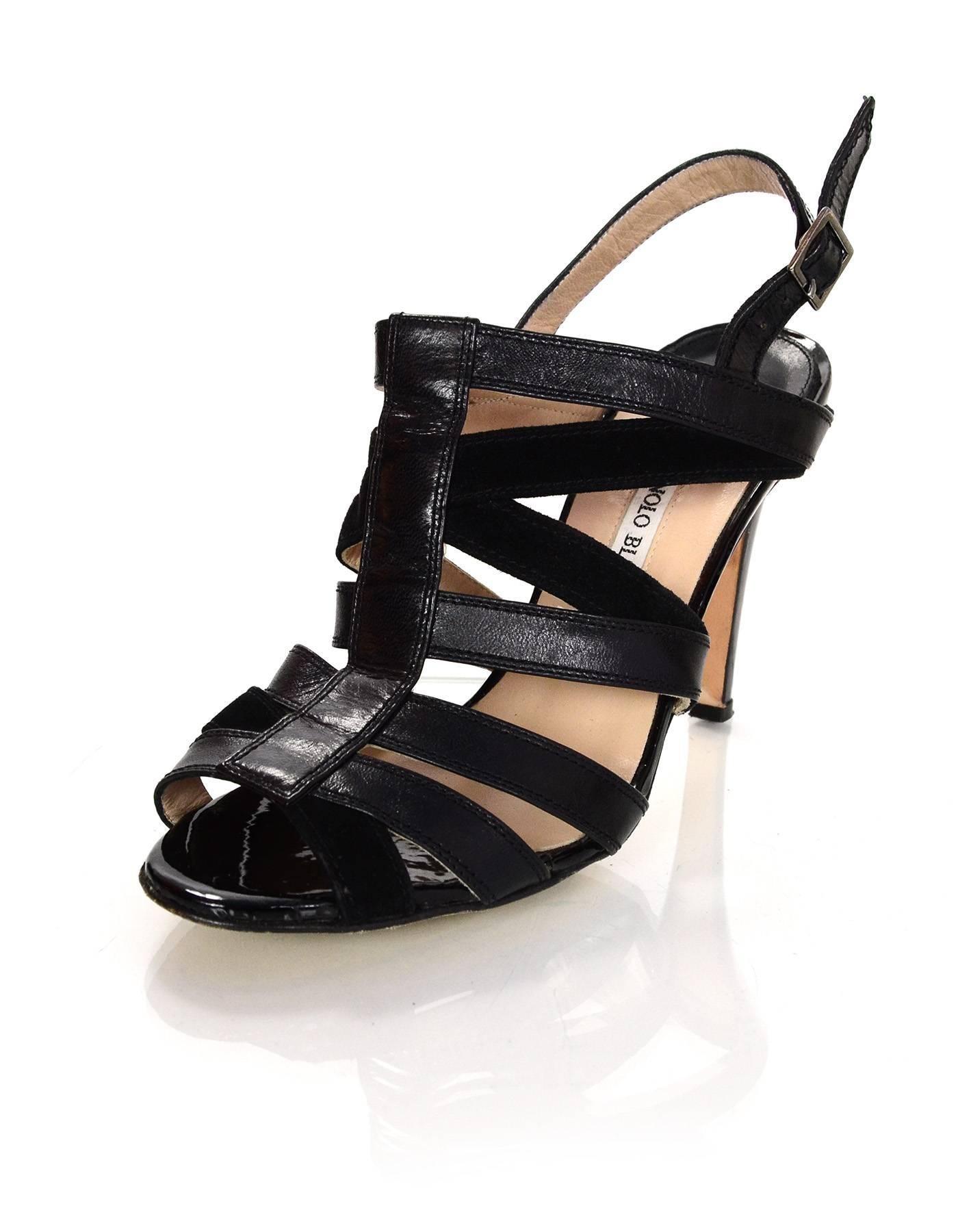 Manolo Blahnik Black Leather & Suede Strappy Sandals 
Features patent leather wrapped heel and insole toe cushion

Color: Black
Materials: Leather, patent leather and suede
Closure/Opening: Ankle strap with buckle and notch closure
Sole Stamp:
