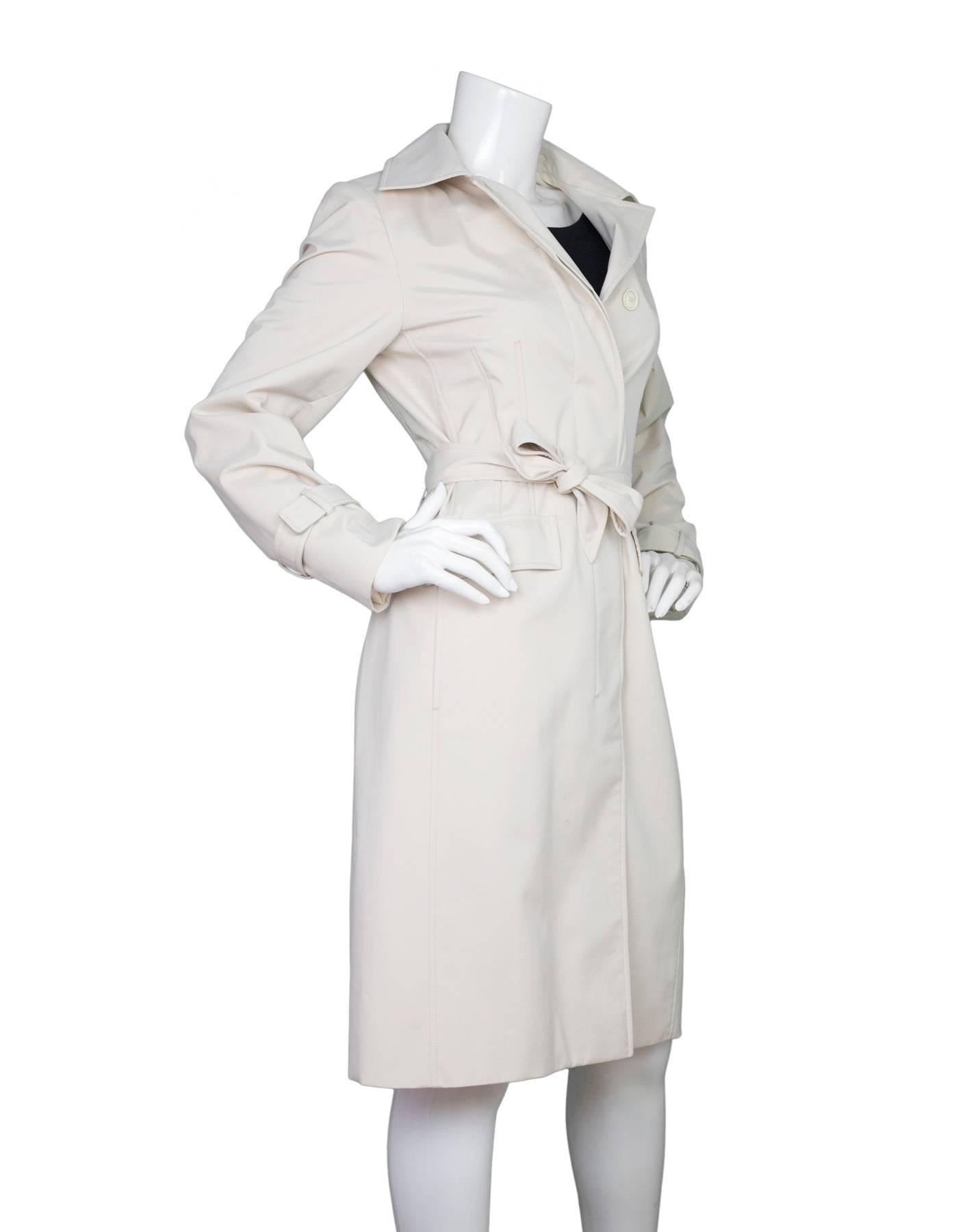 Loro Piana Storm System Beige Trench Coat 
Features optional waist belt

Made In: Italy
Color: Beige
Composition: 100% Nylon
Lining: Beige, 100% polyester
Closure/Opening: Button down front and waist belt
Exterior Pockets: Two hip pockets
Interior