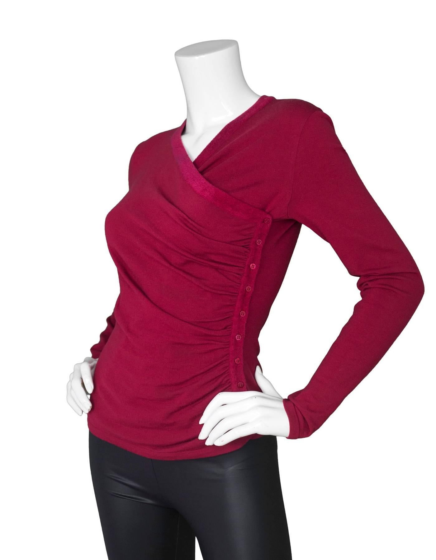 Alaia Burgundy Wool Ruched Long Sleeve Top 
Features buttons and ruching down side of shirt

Made In: Italy
Color: Burgundy
Composition: 84% wool, 14 polyester, 2% cupro
Lining: None
Closure/Opening: Pull over
Exterior Pockets: None
Interior