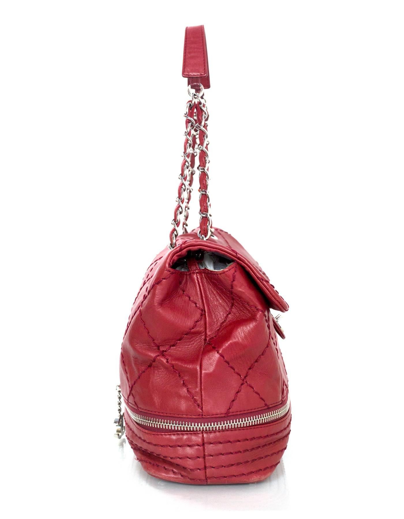 Chanel Red Expandable Ligne Quilted Zipper Flap Bag
Features expandable bottom with zip around 

Made In: France
Year of Production: 2006-2008
Color: Red
Hardware: Silvertone
Materials: Leather
Lining: Beige canvas
Closure/Opening: Flap top with CC