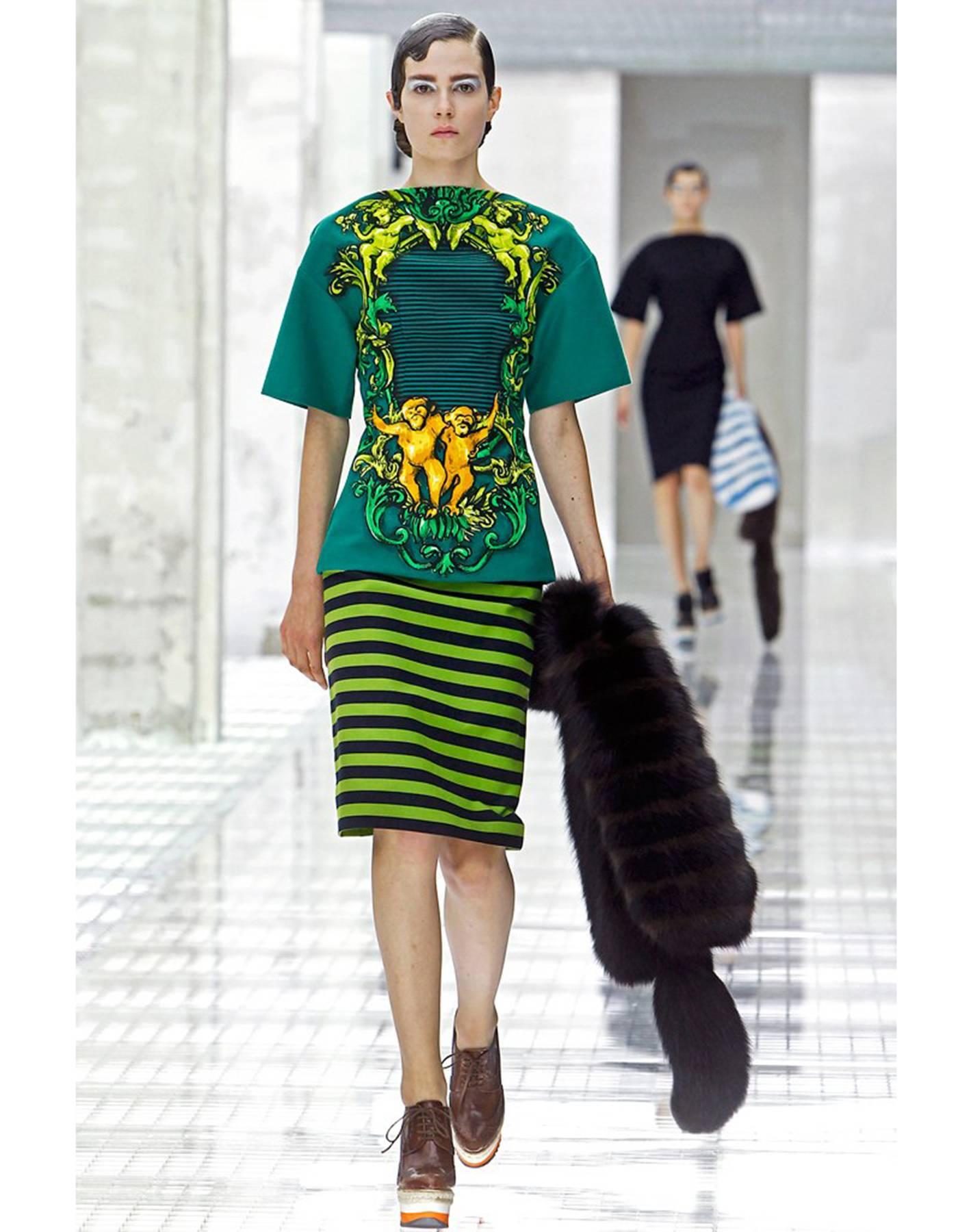 Prada S/S '11 Green Monkey Printed Cotton Tunic
Features stripes, cupid and monkey prints

Made In: Italy
Year of Production: 2011
Color: Black, green, yellow and orange
Composition: 98% cotton, 2% other fibers
Lining: Black, 74% cupro, 26%