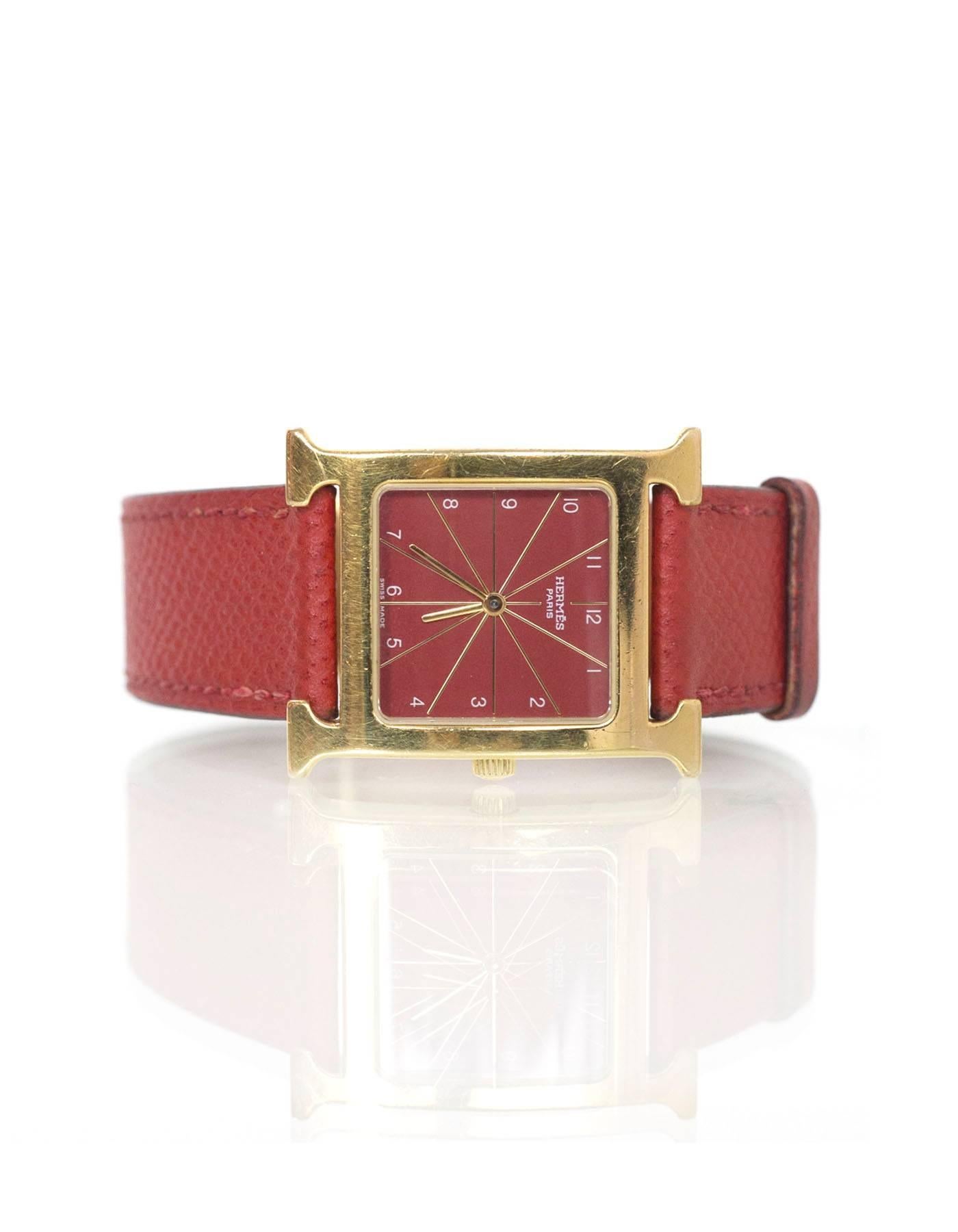 Hermes Red Heure H MM Watch.  Features red face and goldtone H

Made In: Switzerland
Year of Production: 2011/2012
Color: Red, gold
Materials: Leather, steel, glass 
Closure: Buckle
Stamp: HH1.510 1040039 
Overall Condition: Excellent pre-owned
