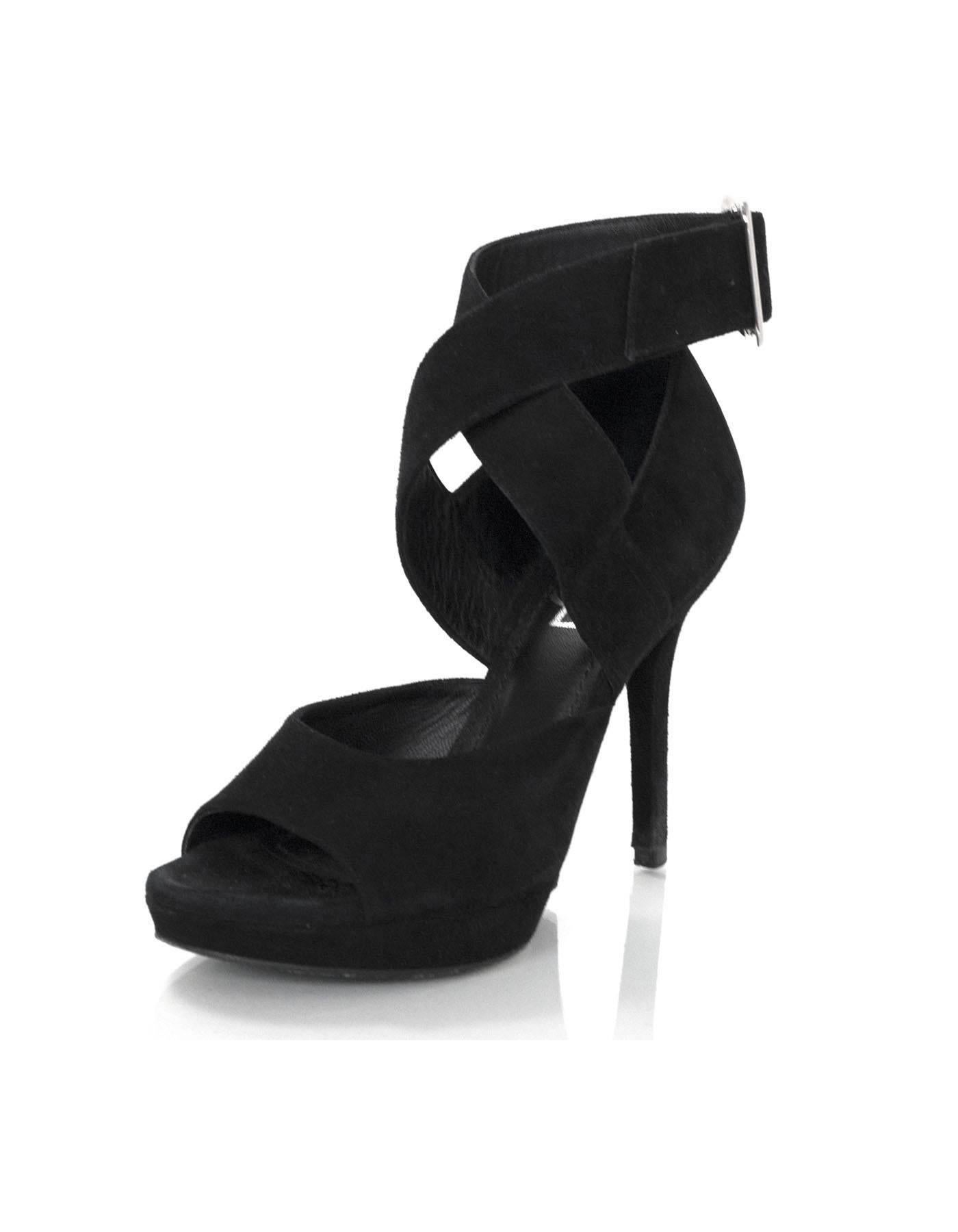 Yves Saint Laurent Black Suede Sandals Sz 35

Materials: Suede
Closure/Opening: Buckle closure at ankle
Overall Condition: Very good pre-owned condition with the exception of separation at heels, worn outsoles and marks at toes

Marked Size: 35
Heel