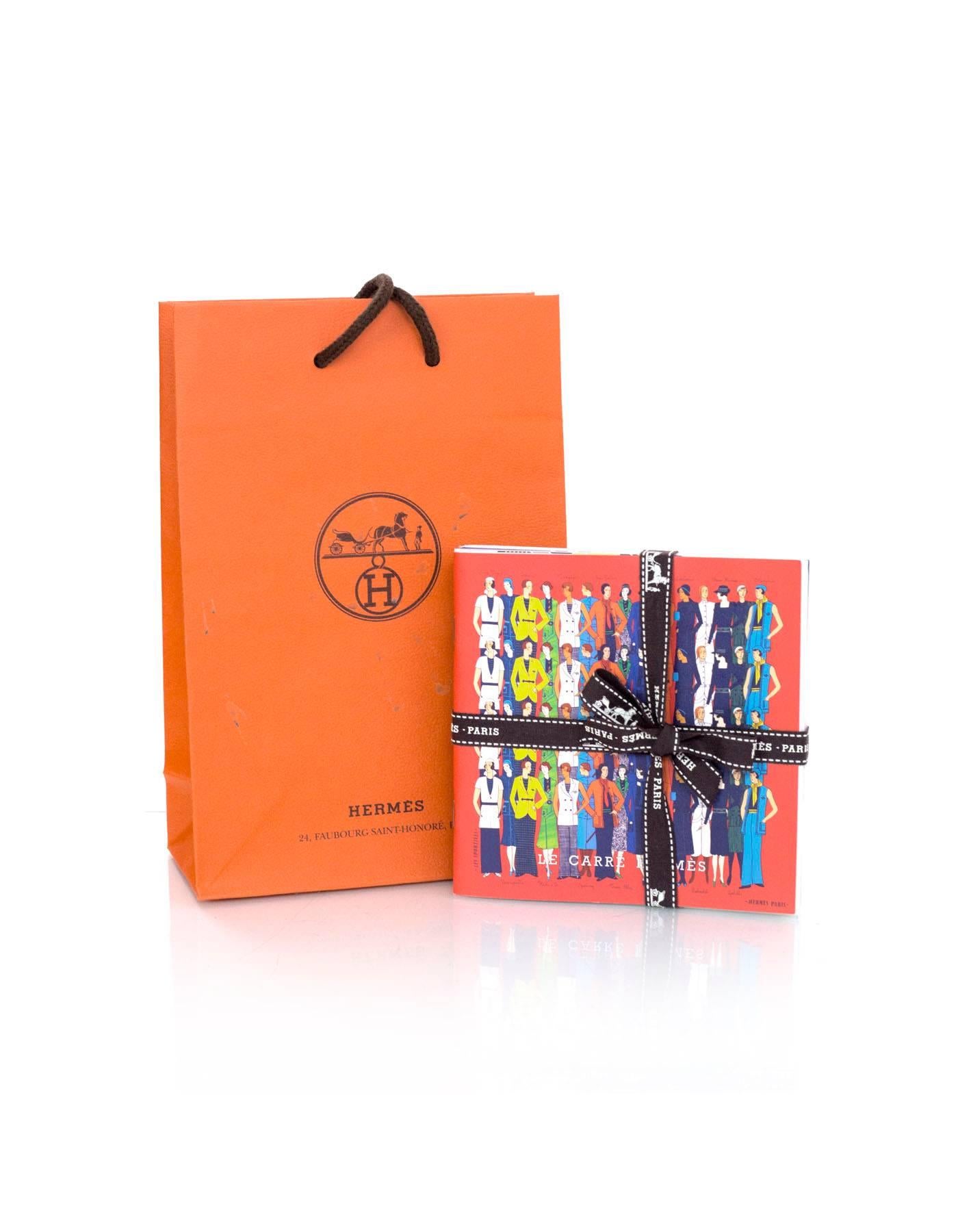 Set of four Hermes illustrated booklets featuring ways to tie Hermes scarves, prints and names. From SS '13, AW '13, SS '14 and AW '14. Shopping bag included.

Condition: Excellent pre-owned condition

Measurements:
Booklets: 5"W x 5"L