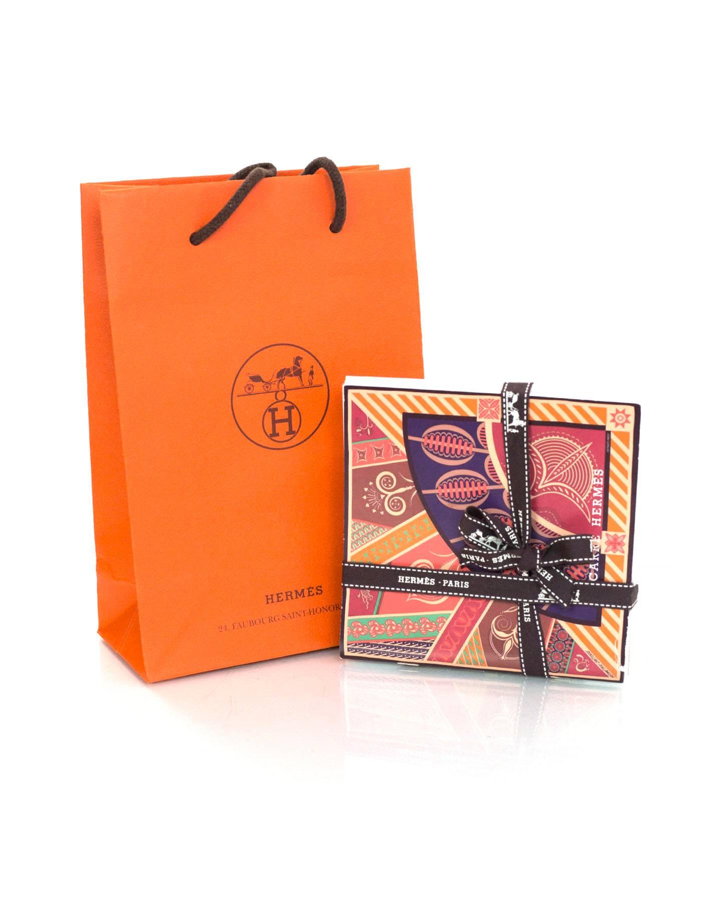 Set of four Hermes illustrated booklets featuring ways to tie Hermes scarves, prints and names. From SS '12, AW '13, SS '14 and SS '15. Shopping bag included.

Condition: Excellent pre-owned condition

Measurements:
Booklets: 5"W x 5"L