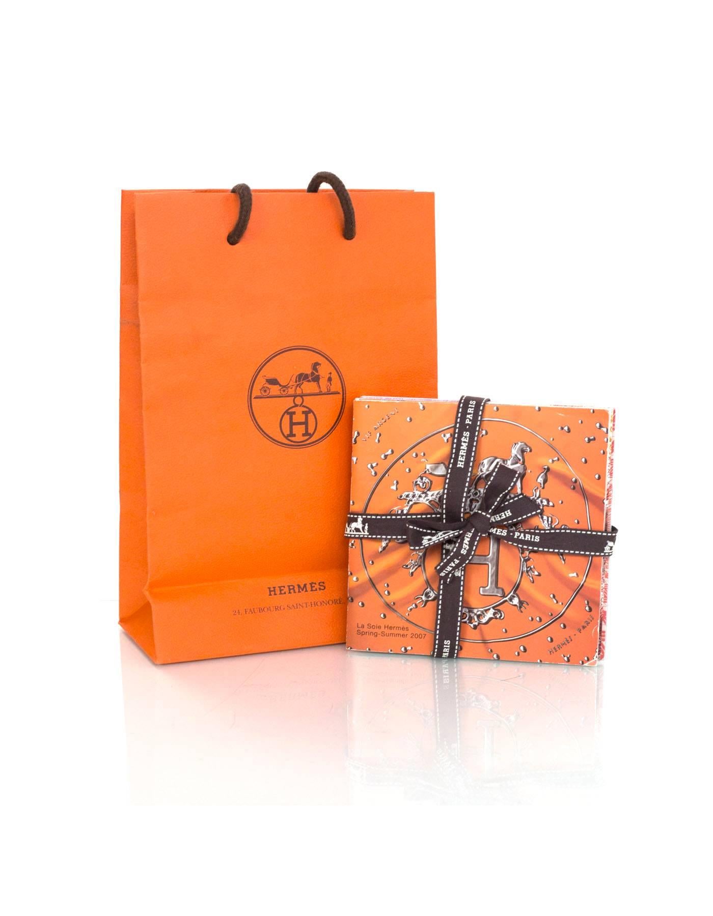 Set of four Hermes illustrated booklets featuring ways to tie Hermes scarves, prints and names. From SS '07, AW '07, SS '08 and SS '09. Shopping bag included.

 Condition: Excellent pre-owned condition

Measurements:
Booklets: 5"W x 5"L