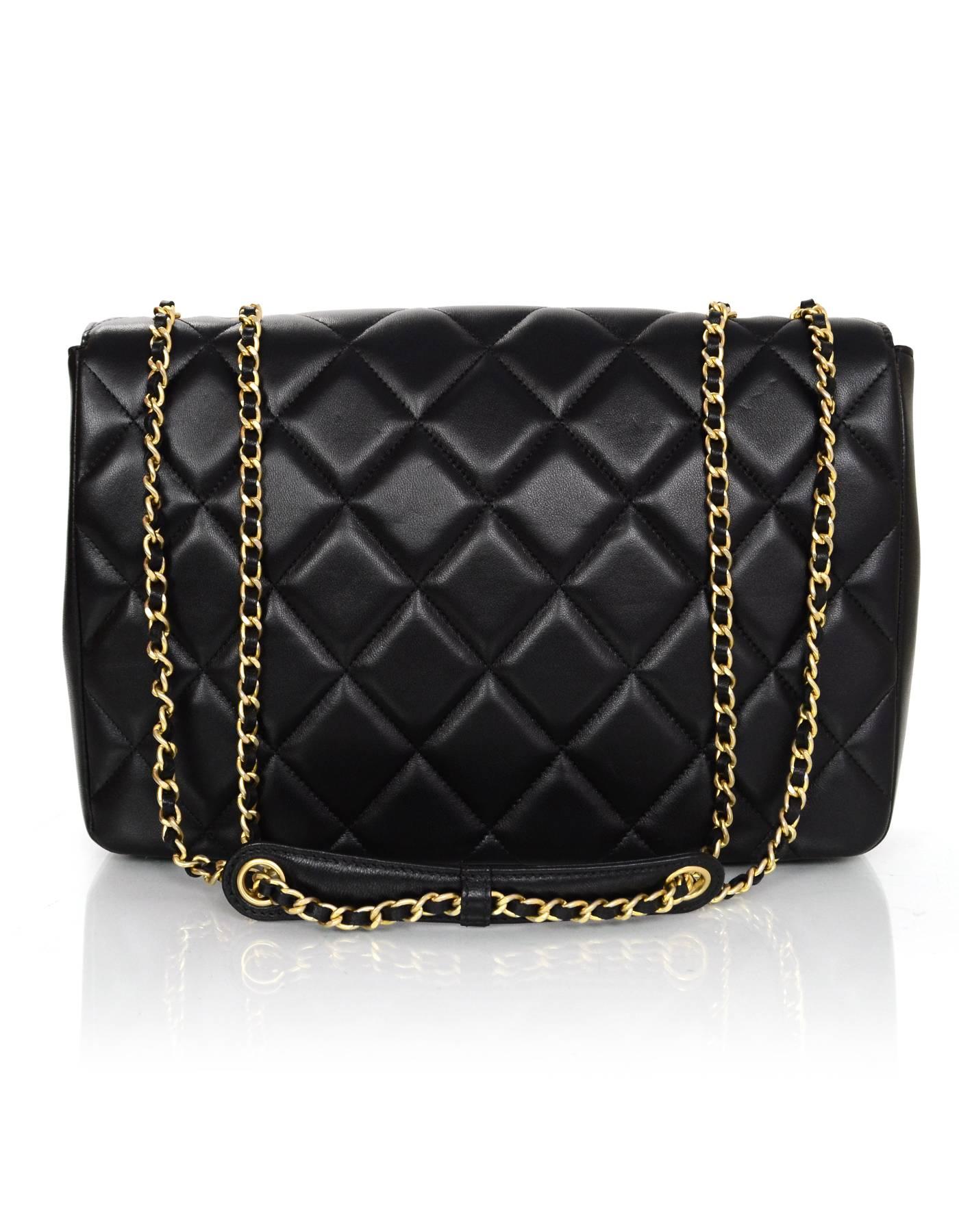 Chanel Quilted Lambskin Diamond CC Medium Flap Bag 
Features adjustable shoulder strap

Made In: Italy
Year of Production: 2014
Color: Black
Hardware: Goldtone
Materials: Lambskin
Lining: Black and burgundy leather
Closure/Opening: Flap top with