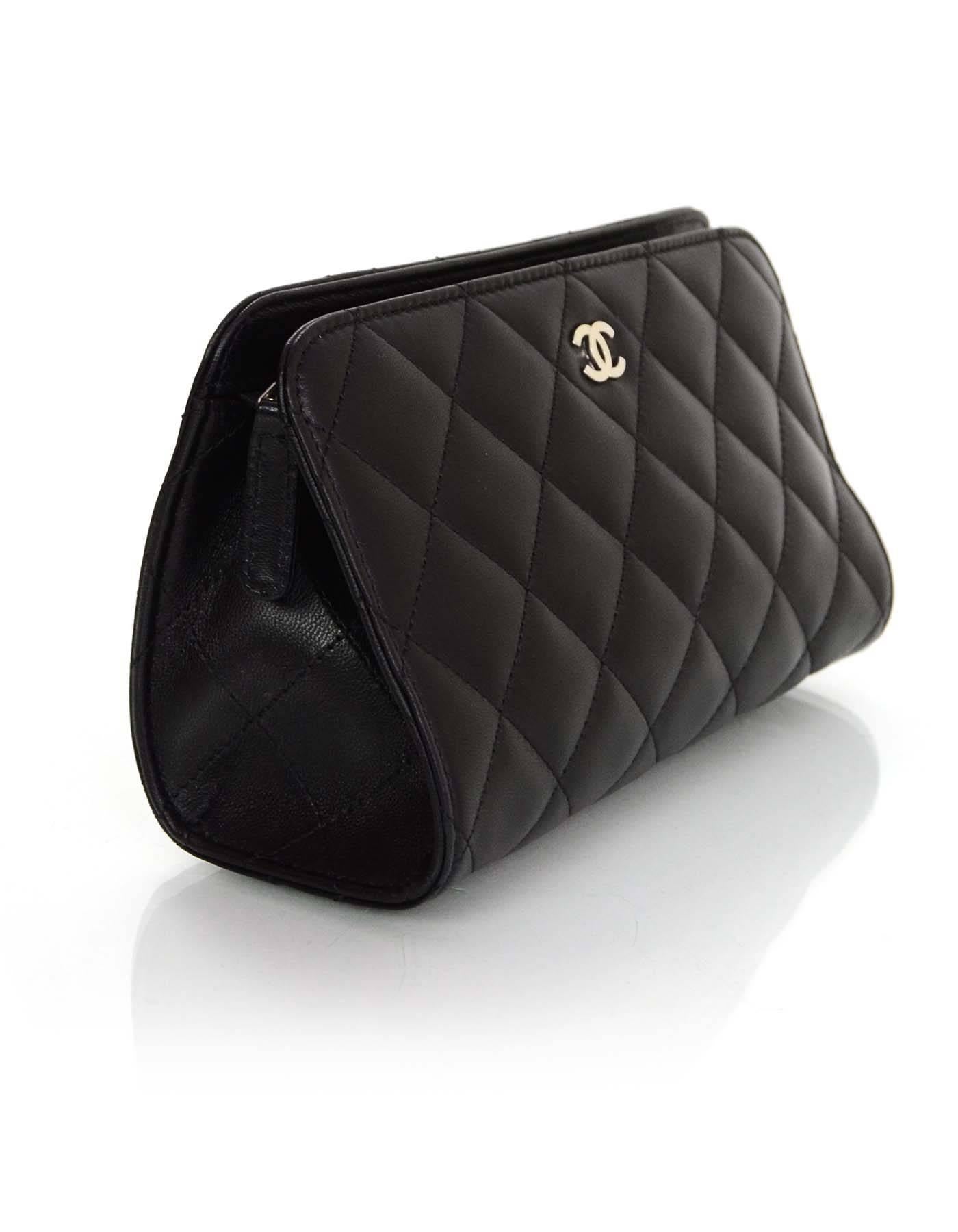 100% Authentic Chanel black leather cosmetic bag/clutch. Features classic Chanel quilting, back half moon pocket, and leather lined interior. 

Made In: France
Year of Production: 2005-2006
Color: Black
Hardware: Silvertone
Materials: Leather