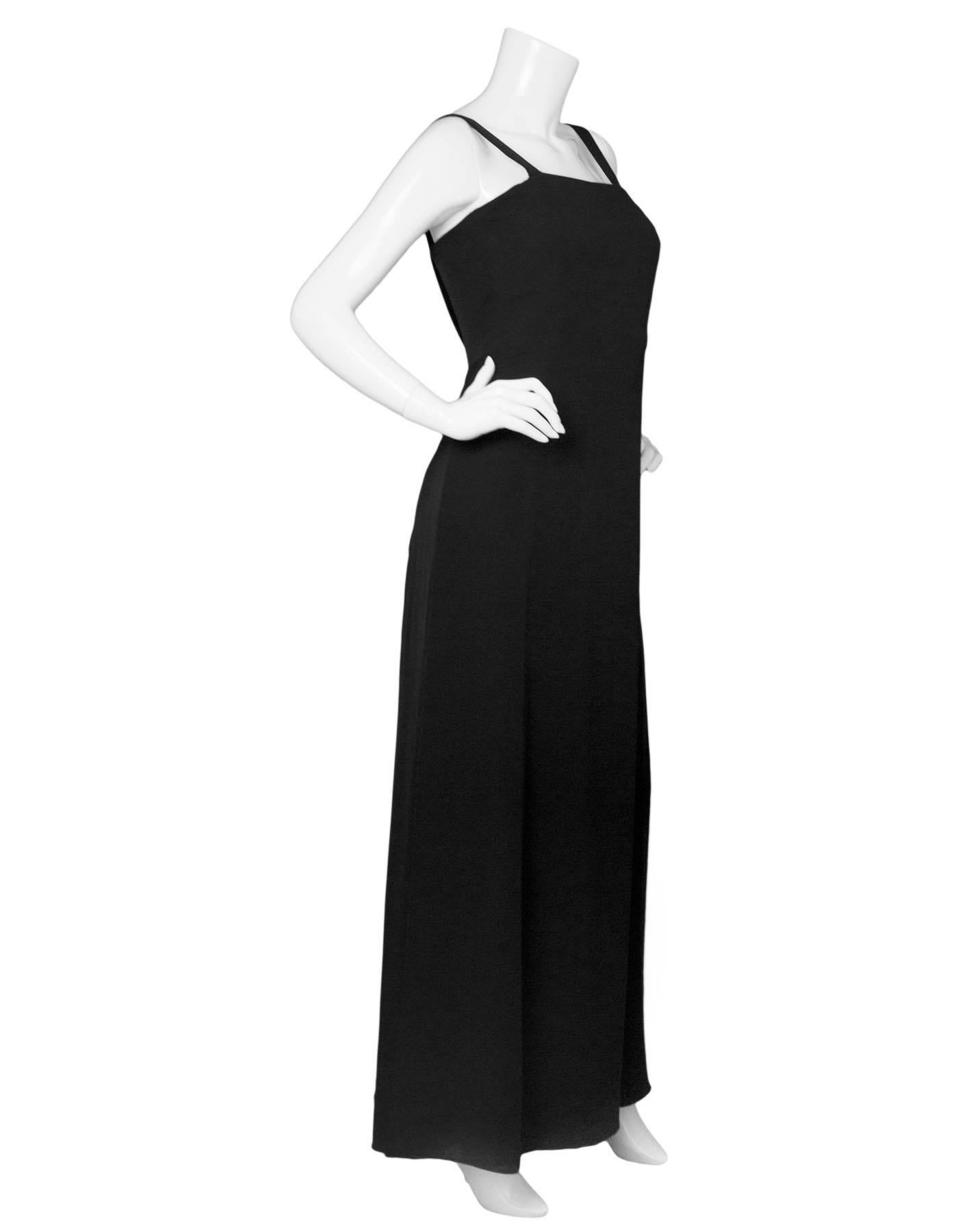 Armani Collezioni Black Gown Sz 8
Features draping at back

Made In: Italy
Color: Black
Composition: 54% Silk, 46% Rayon
Lining: Black silk
Closure/Opening: Hidden side zip closure
Overall Condition: Excellent pre-owned condition with the exception